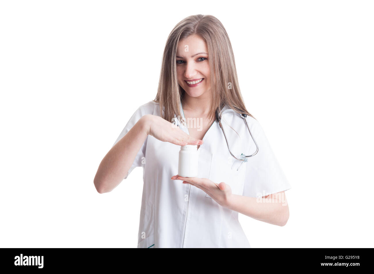 Young female doctor holding a white unlabeled bottle of medicine or pills Stock Photo