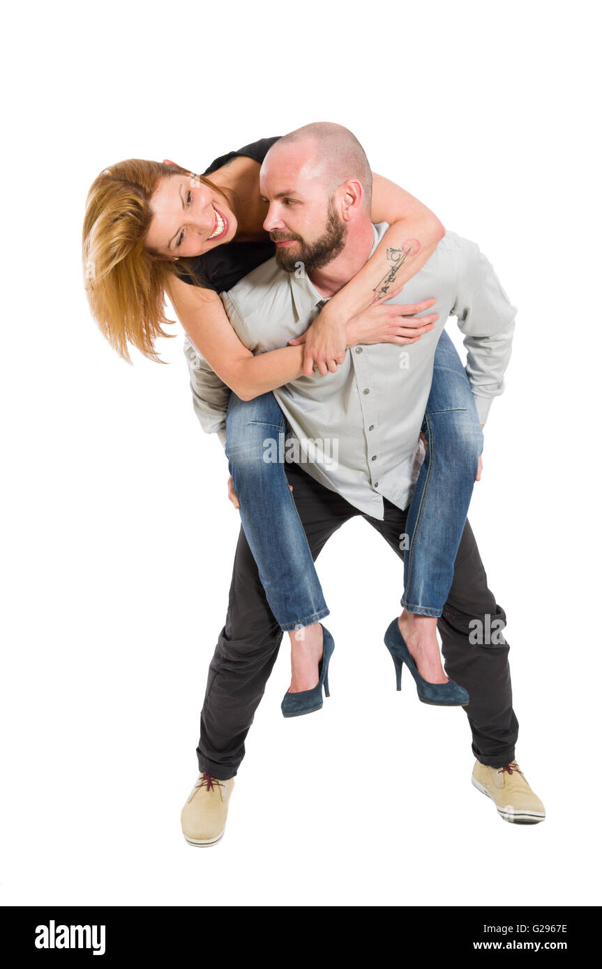 Happy young couple having fun on white studio background Stock Photo ...