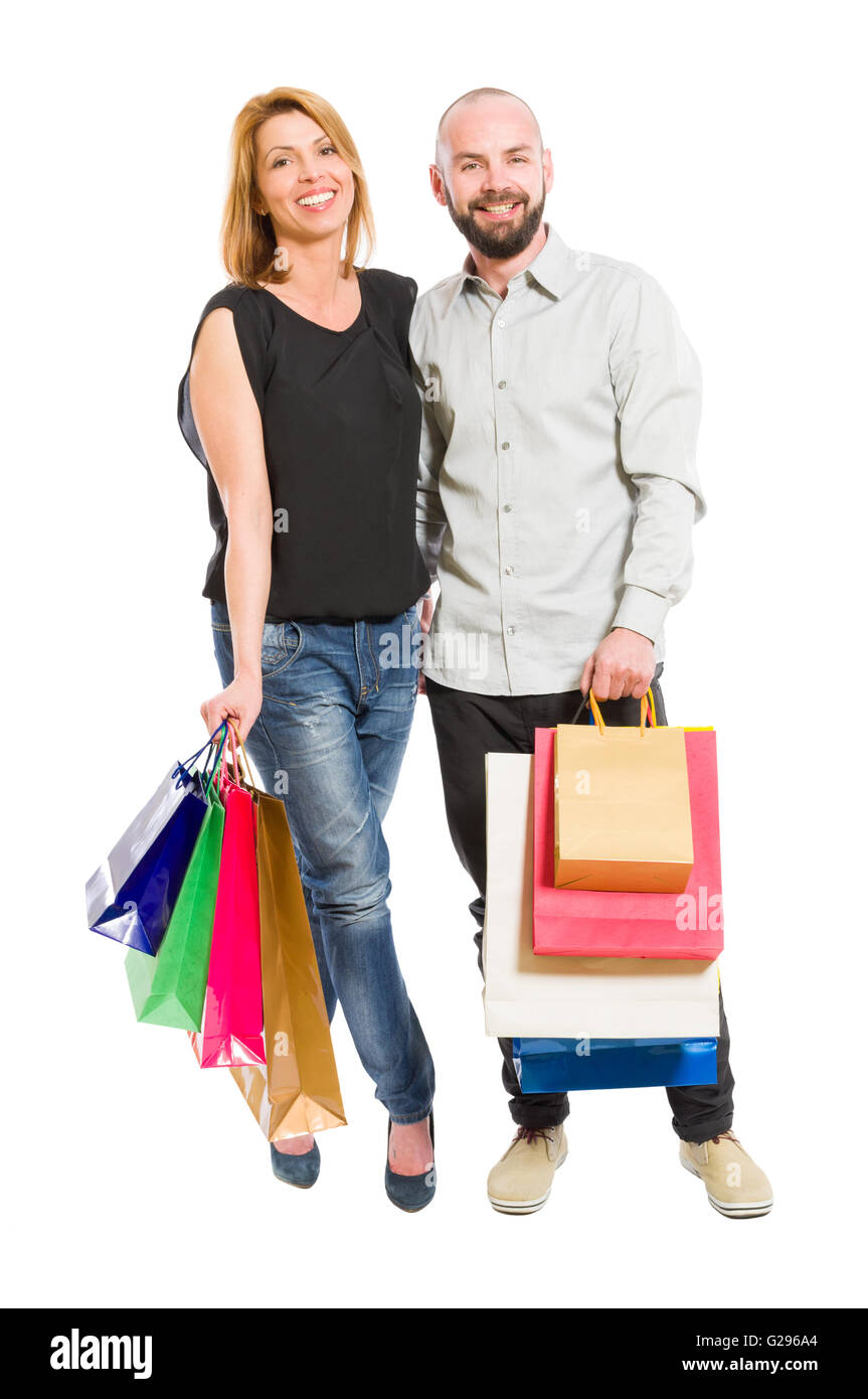 Shopping couple or family like husband and wife standing on white background Stock Photo
