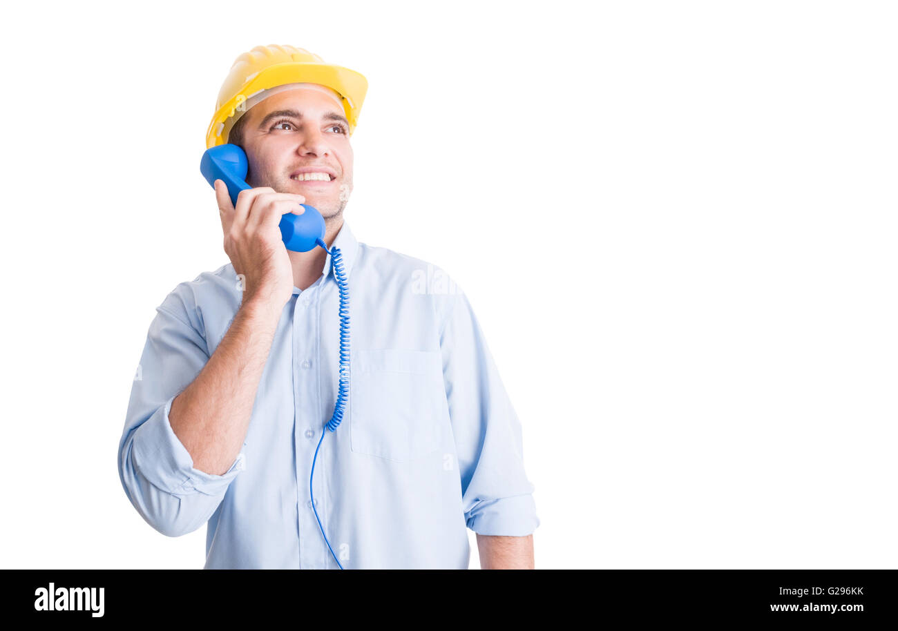 Visionary engineer talking on the phone and looking up Stock Photo