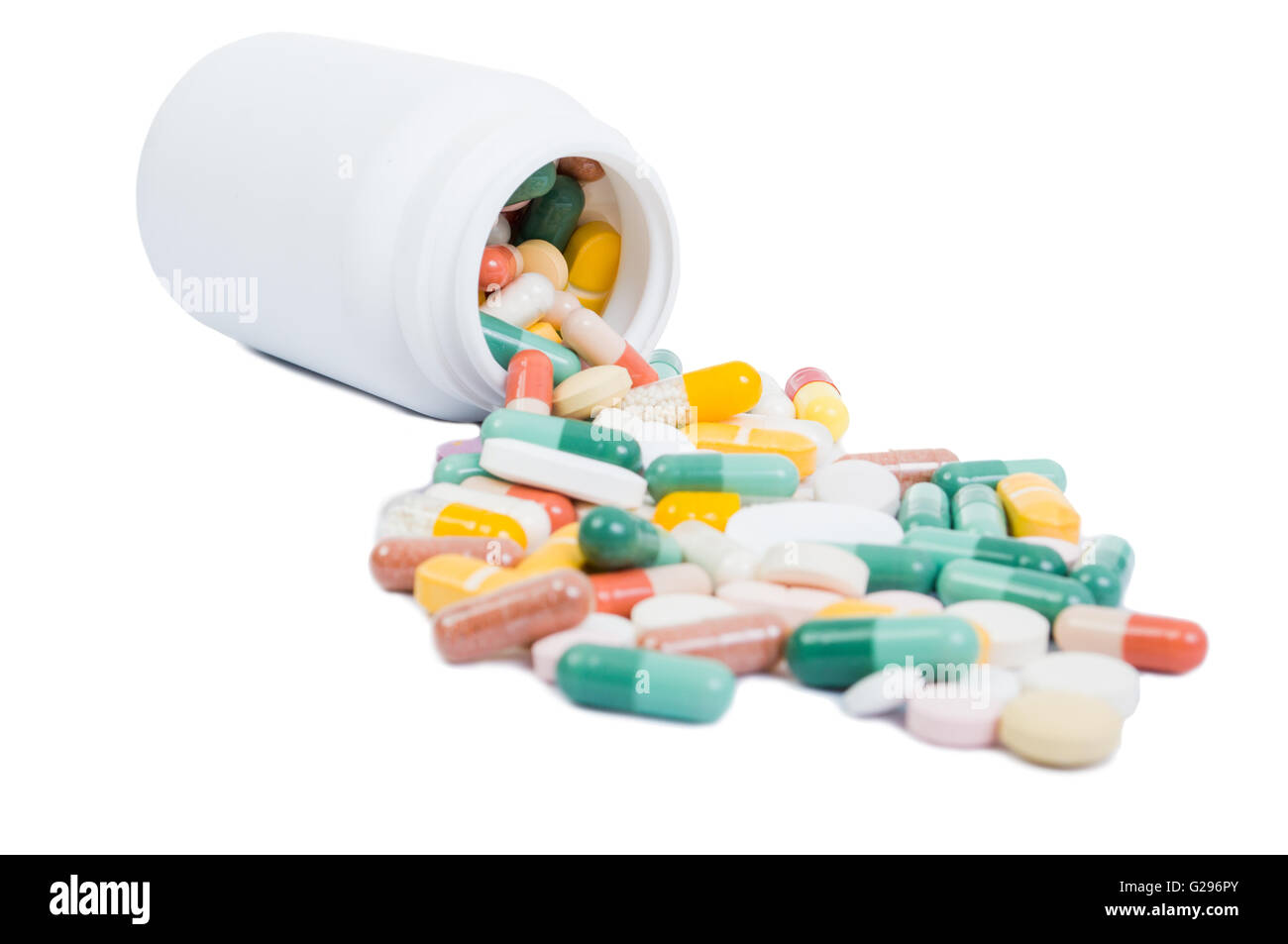 Spilled pills and open bottle isolated on white background Stock Photo