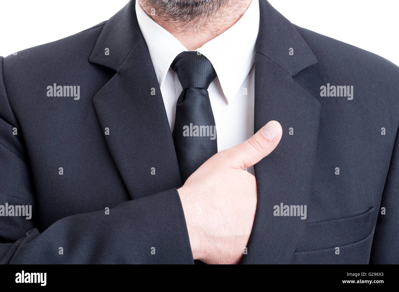Elegant and formal business man inserting hand inside suit jacket Stock