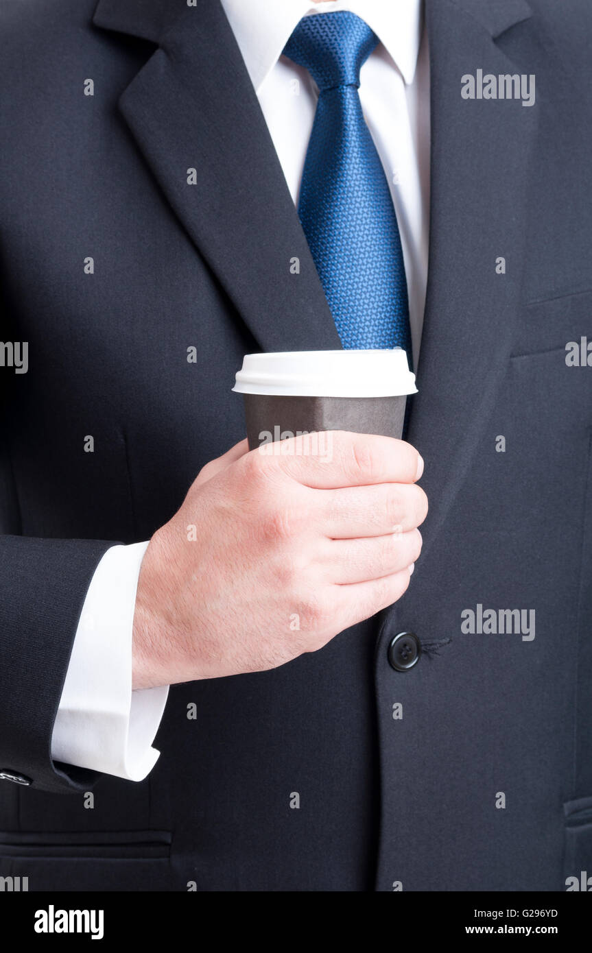 Business coffee break concept with a hand holding a cup Stock Photo - Alamy