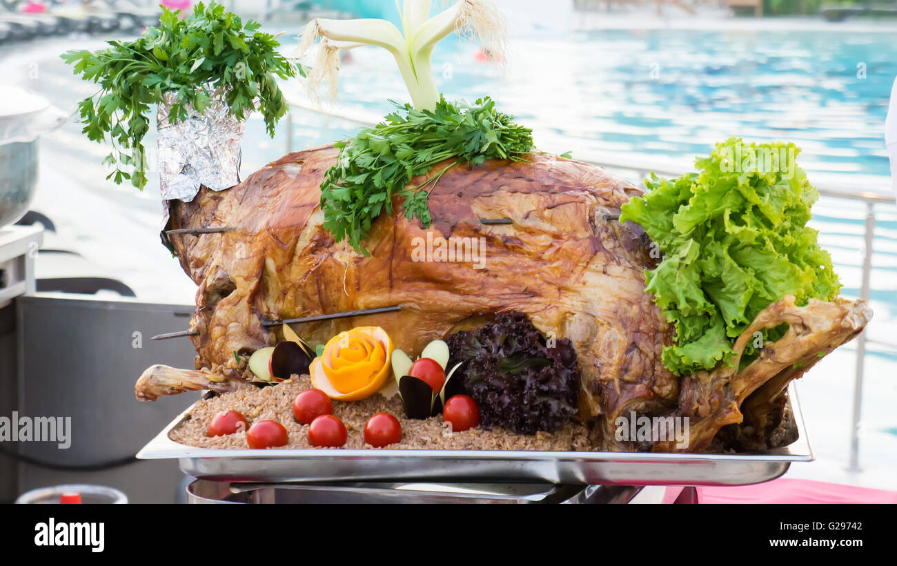 Whole roasted lamb with vegetables and rice Stock Photo Alamy