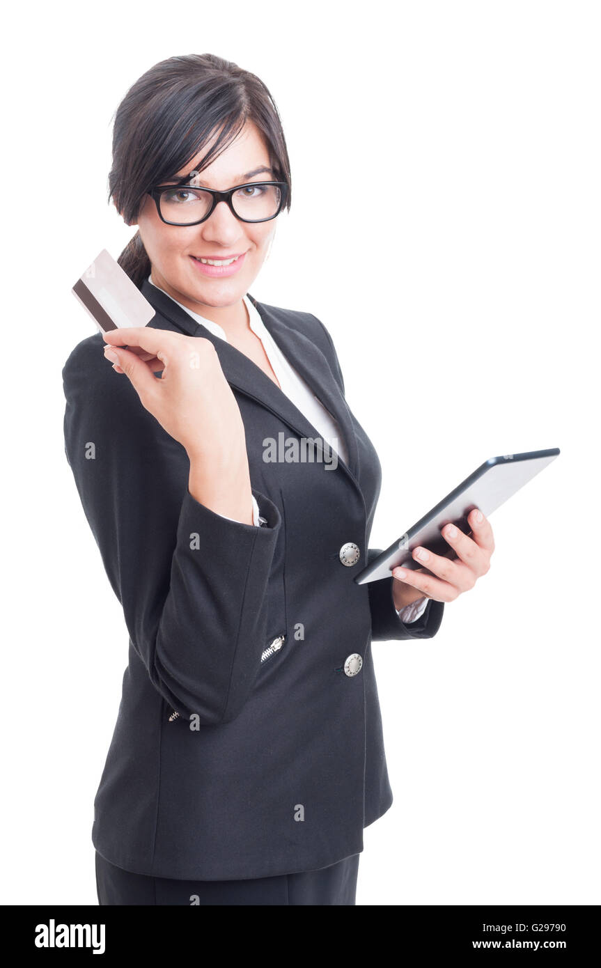 Online saleswoman holding a credit or debit card and tablet isolated on white background Stock Photo