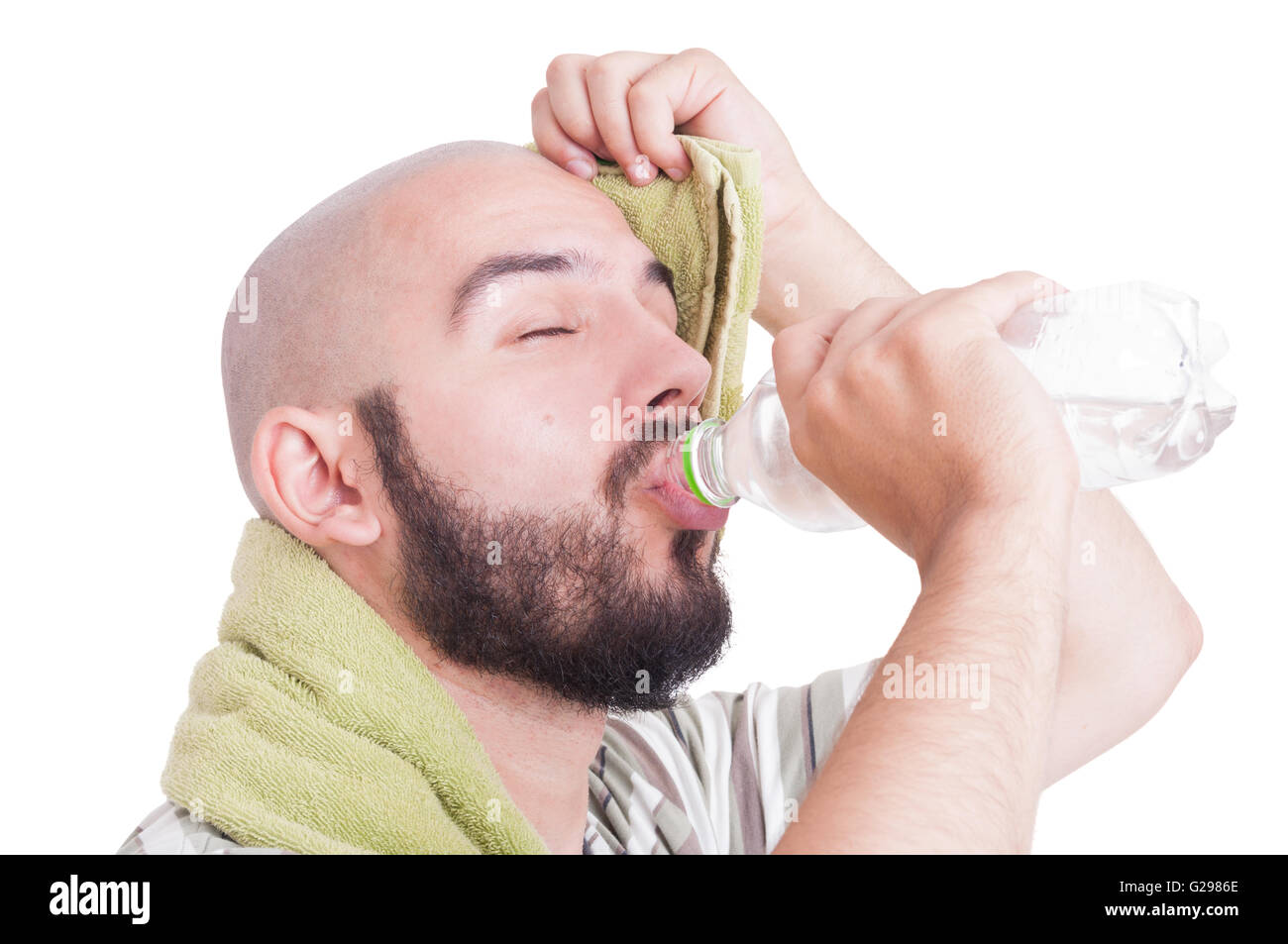 Man drinking water and wiping sweaty forehead isolated on white Stock Photo
