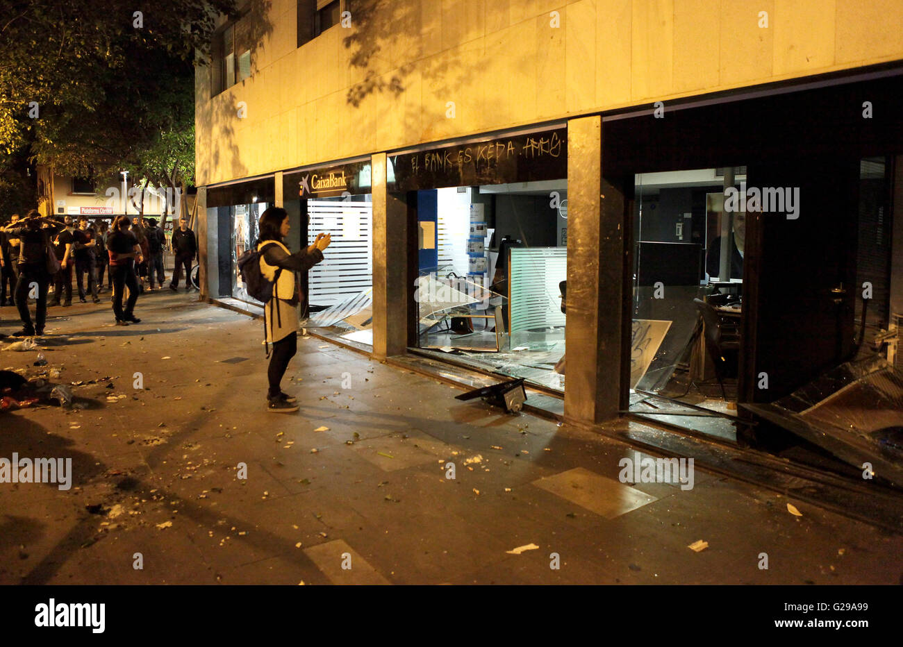 Barcelona, Spain. 25th May, 2016. Riot Police and activists clash again this evening for the third night in succession in the Gracia district of Barcelona, catalonia. windows of Banks smashed adding to the thousands of Euros damage caused in last 3 days since the squatters were forced out from an empty bank building in the area. Credit:  rich bowen/Alamy Live News Stock Photo