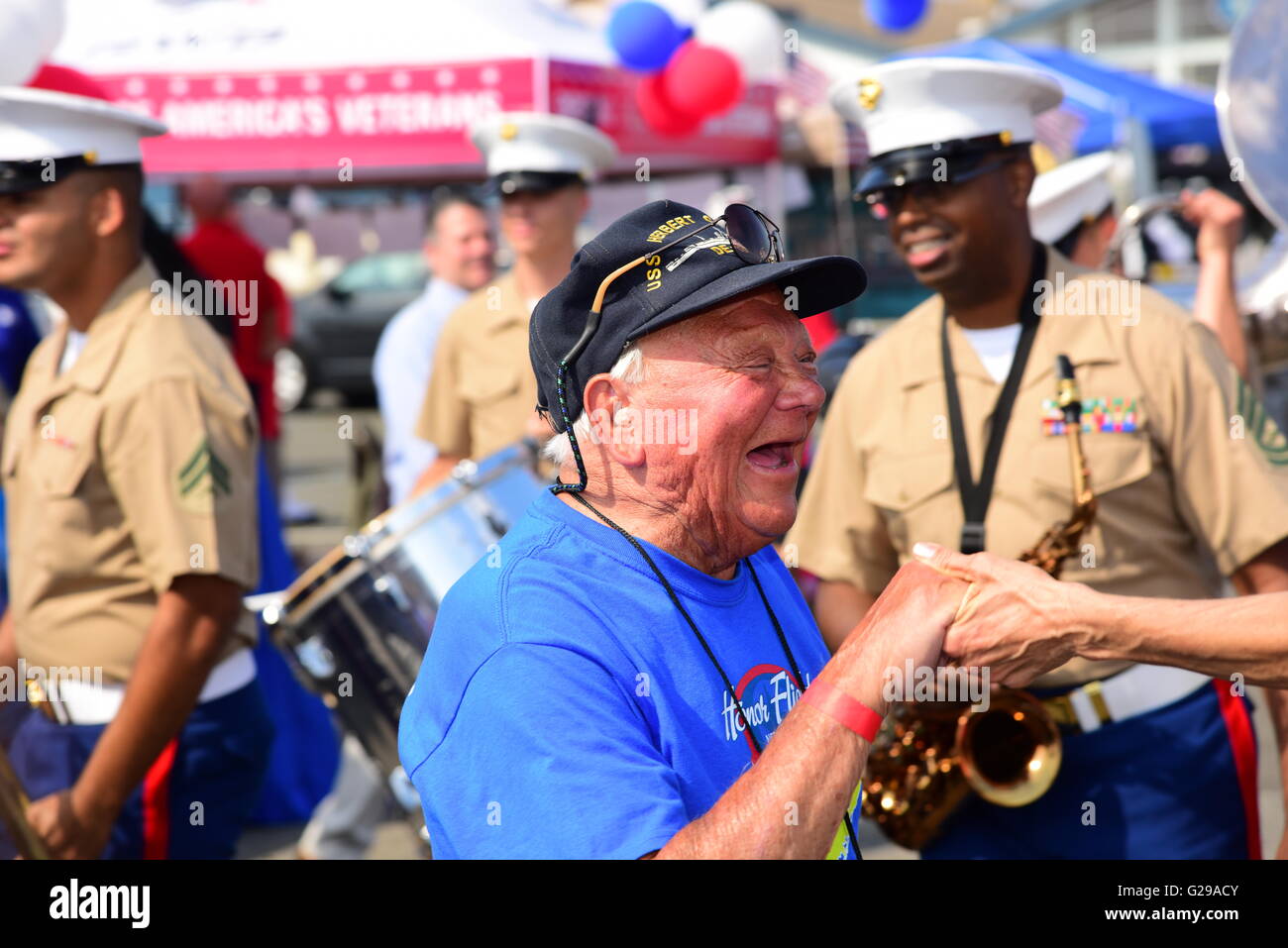 New York City, United States. 25th May, 2016. World War ii vet Bill Nacinovich dancing to Marine band. The 28th annual NYC Fleet Week brought US navy & coast guard ships to the Brooklyn Ferry Terminal in Red Hook where sailors, guard & marines were greeted with entertainment, awards & hearty bbq plates. Credit:  Andy Katz/Pacific Press/Alamy Live News Stock Photo