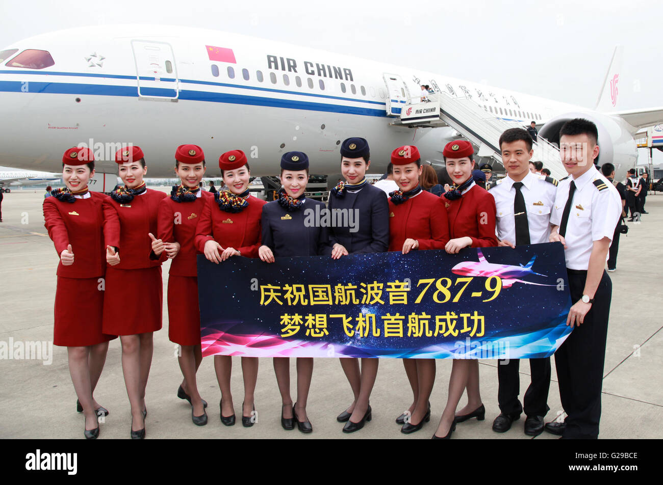 Chengdu. 26th May, 2016. Air crew of Air China's Boeing 787-9 Dreamliner pose for a group photo upon their arrival at the Shuangliu Airport in Chengdu, southwest China's Sichuan Province, May 26, 2016. Air China's newest medium-sized Boeing 787-9 aircraft made its first flight from Beijing to Chengdu on Thursday. The company's 787-9 aircraft are scheduled to operate the Beijing-Shanghai and Beijing-Guangzhou routes in the future. Credit:  Xinhua/Alamy Live News Stock Photo