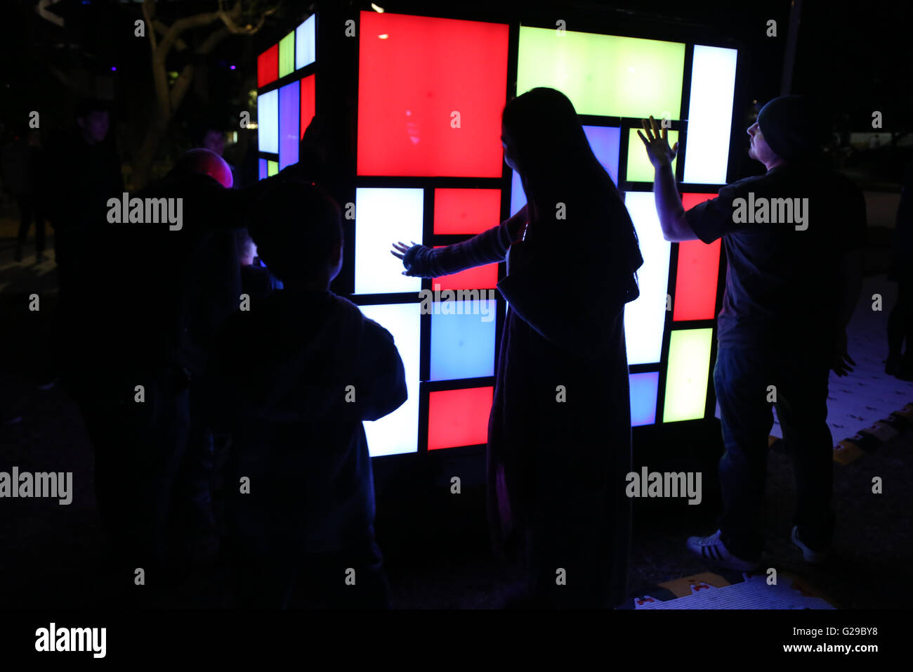 Sydney, Australia. 26 May 2016. Vivid Sydney, the world’s largest festival of light, music and ideas runs for 23 nights from 27 May-18 June 2016. Pictured: Mondrian Cube (AUS): Mondrian Cube reinterprets the abstract artwork of Dutch painter, Piet Mondrian, into a dynamic, interactive installation that enables users to change core visual elements into their own masterpieces of pattern, colour and balance. Credit:  Richard Milnes/Alamy Live News Stock Photo
