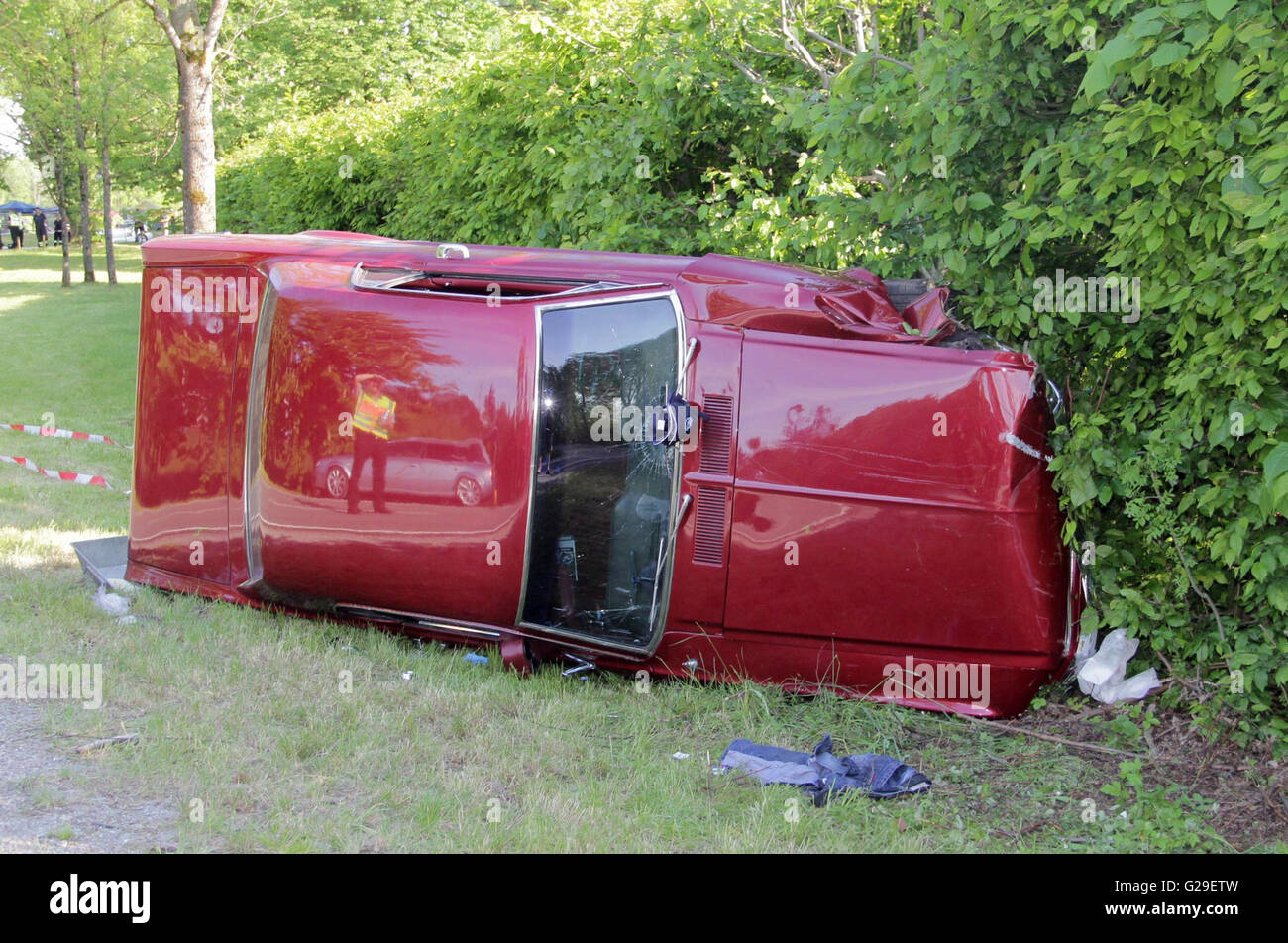 A car that took part in a classic car rally lies on the side of the