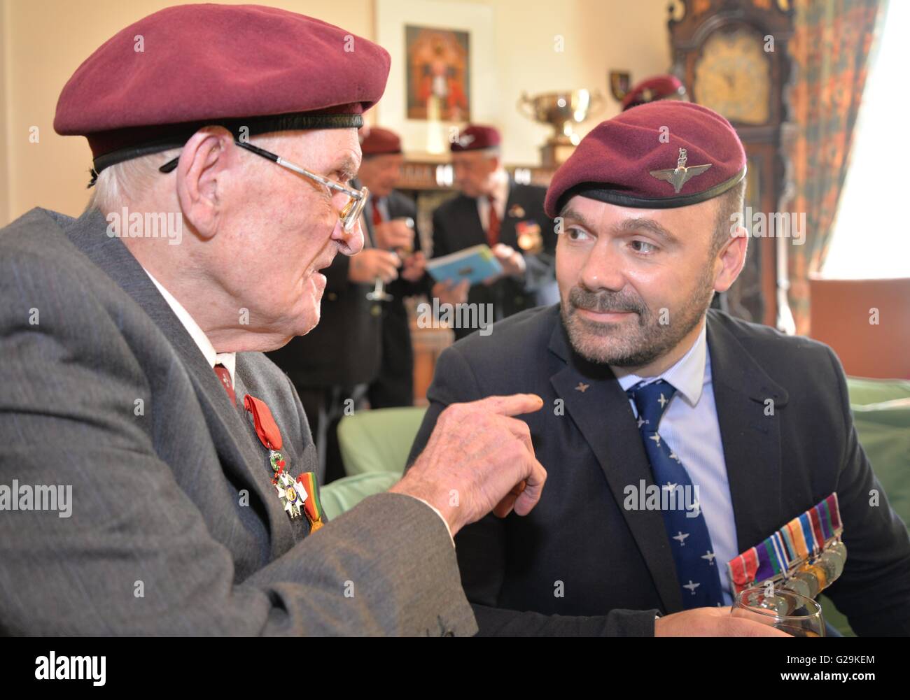 Newport Wales UK. 27th May, 2016. Legion d'Honneur Presentation. D-Day Veteran John Davies from Rogerstone, Newport, Wales, Uk who has been recognised with the highest honour in France the Legion d'Honneur. He is pictured telling veteran from the Newport Parachute Regiment Association Martin Thorpe about his career Credit:  Steven Phillips/Alamy Live News Stock Photo