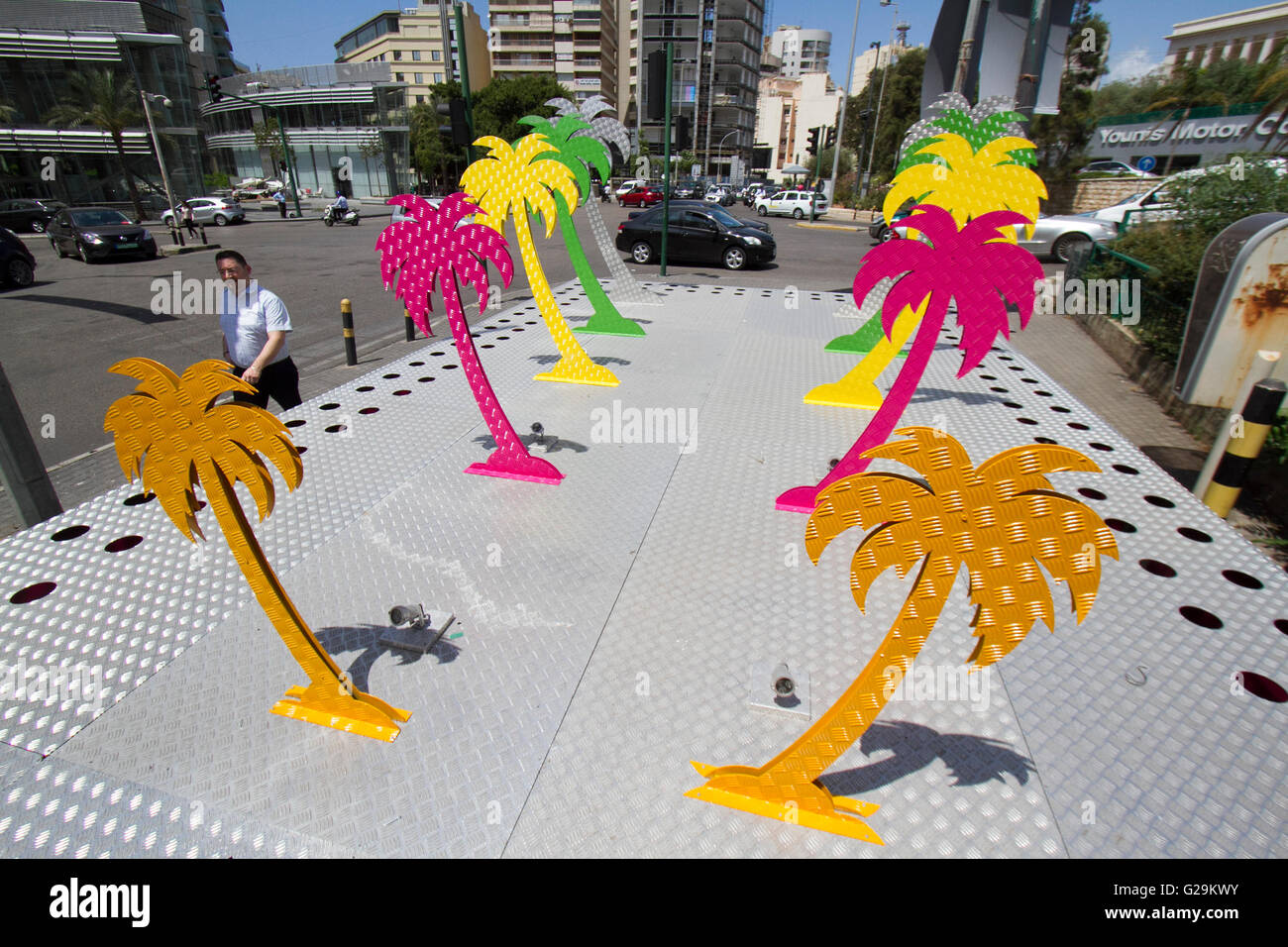 Beirut Lebanon. 27th May 2016. Palm trees are painted in various colors  in central Beirut in preparation for the holy month of Ramadan which begins when the first crescent of a new moon is sighted. The month of Ramadan is spent by Muslims fasting during the daylight hours from dawn to sunset Credit:  amer ghazzal/Alamy Live News Stock Photo