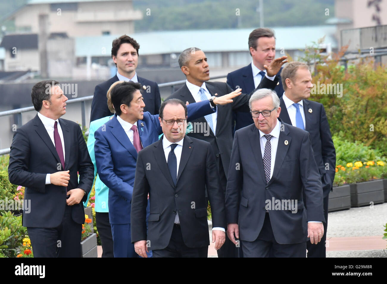 World leaders at the G7 Summit meeting walk together for a group photo ...