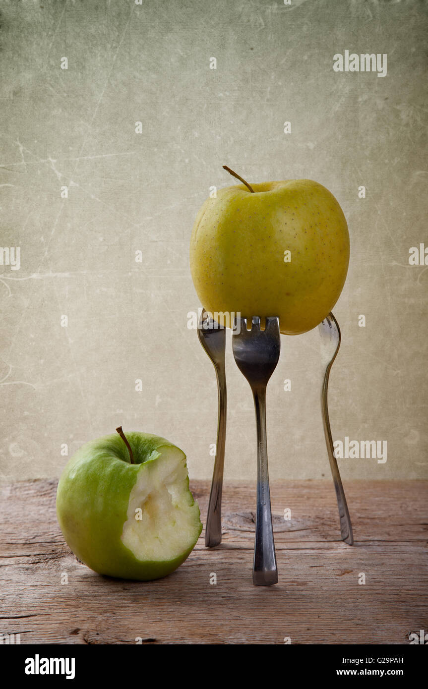Still-Life with Apple stuck on three Forks Stock Photo