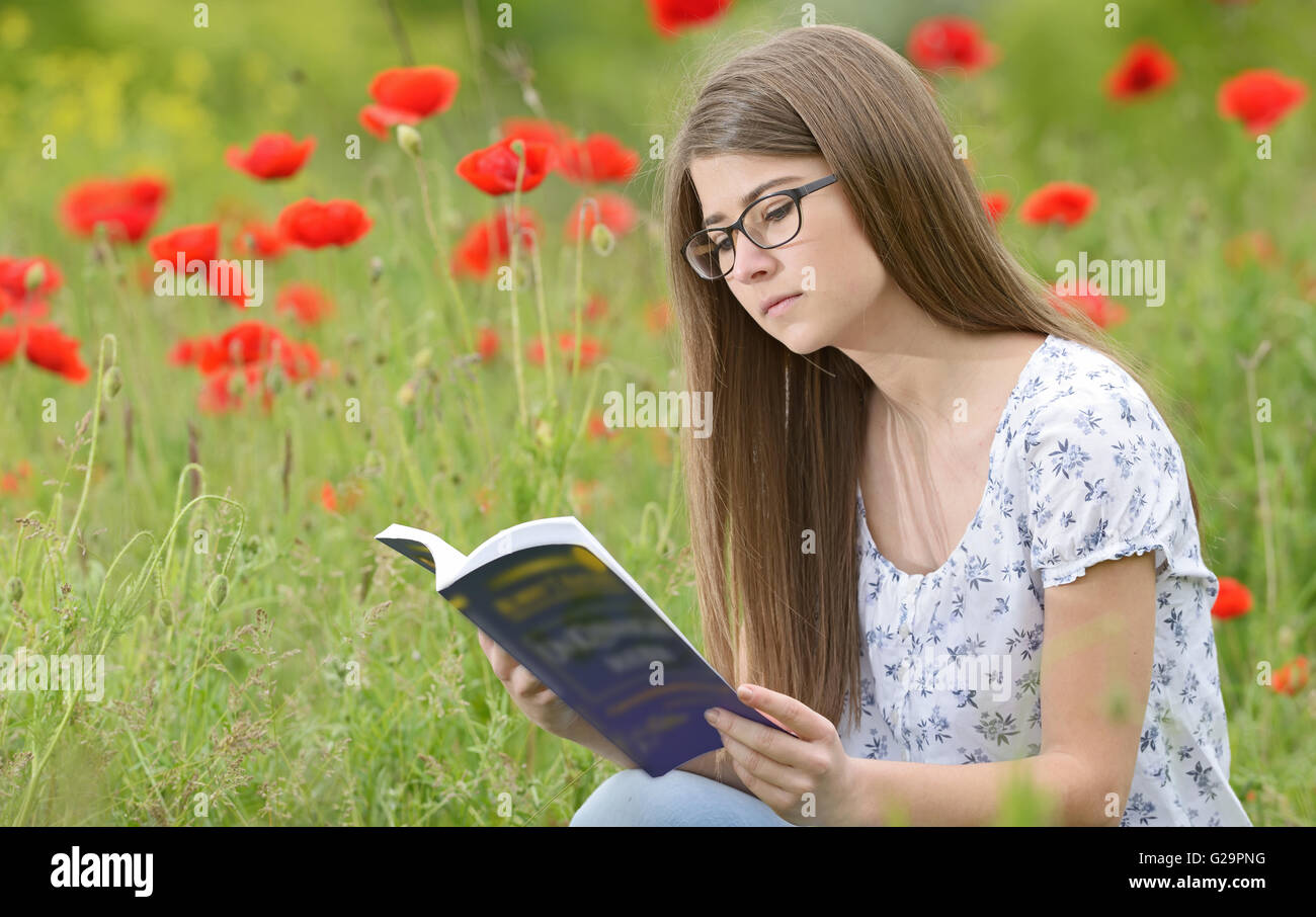Young girl student reading a book Stock Photo