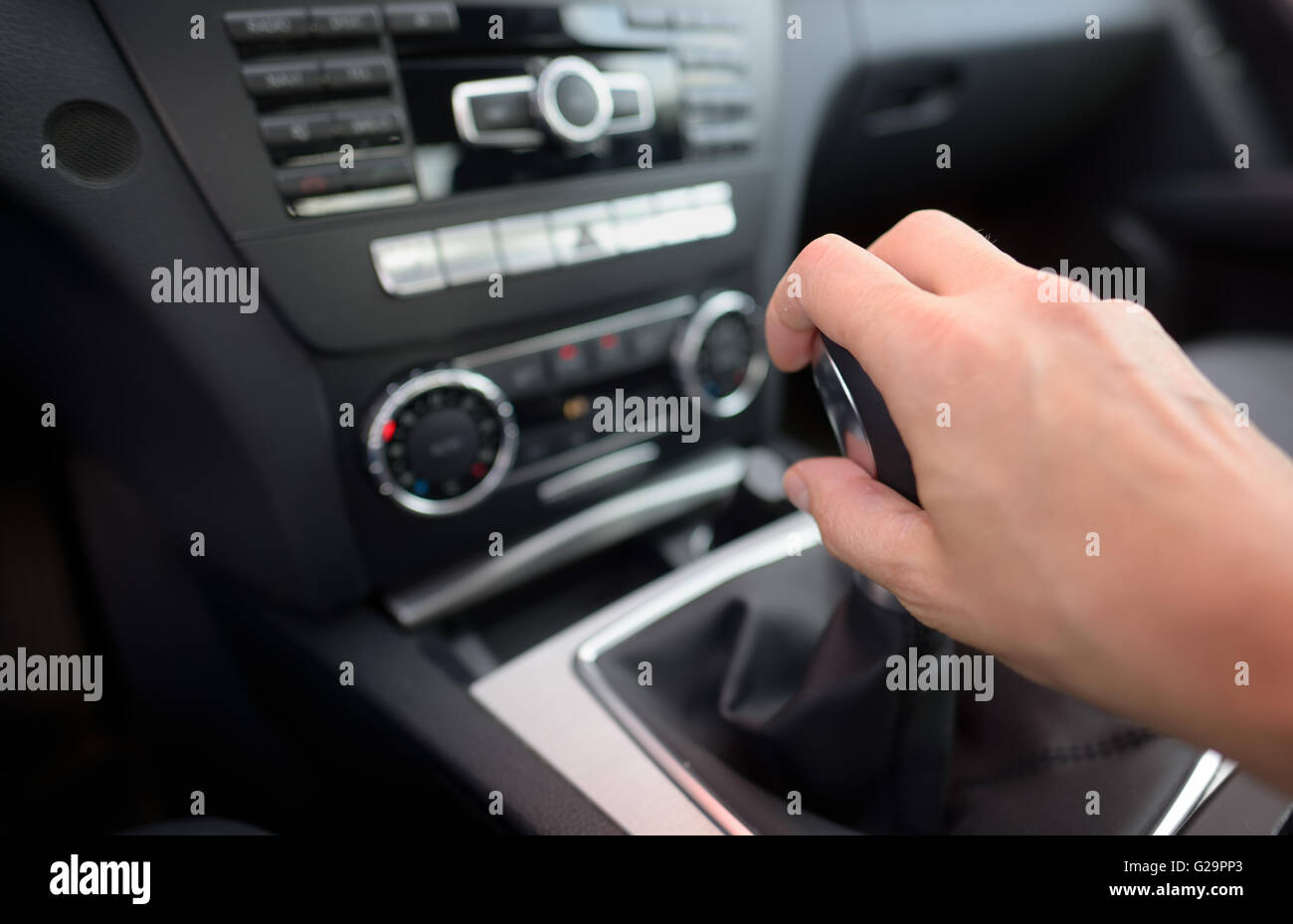 Driver shifting the gear stick inside of car Stock Photo Alamy