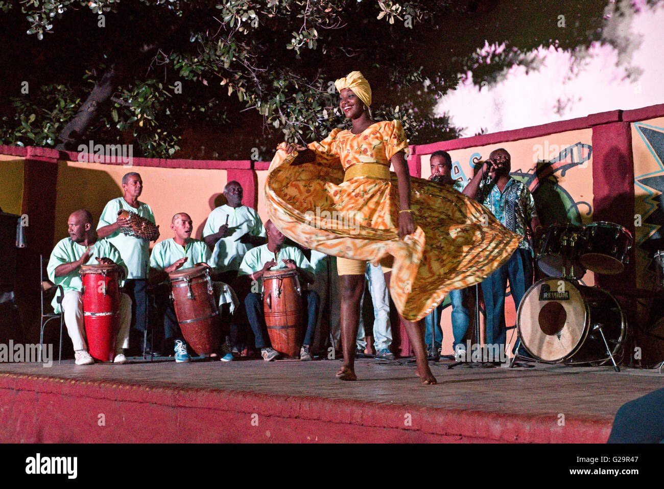 Cuban Afro-Cuban musicians in a group playing and singing for locals and tourists at the Casa de la Músíca in Trinidad, Cuba. Stock Photo