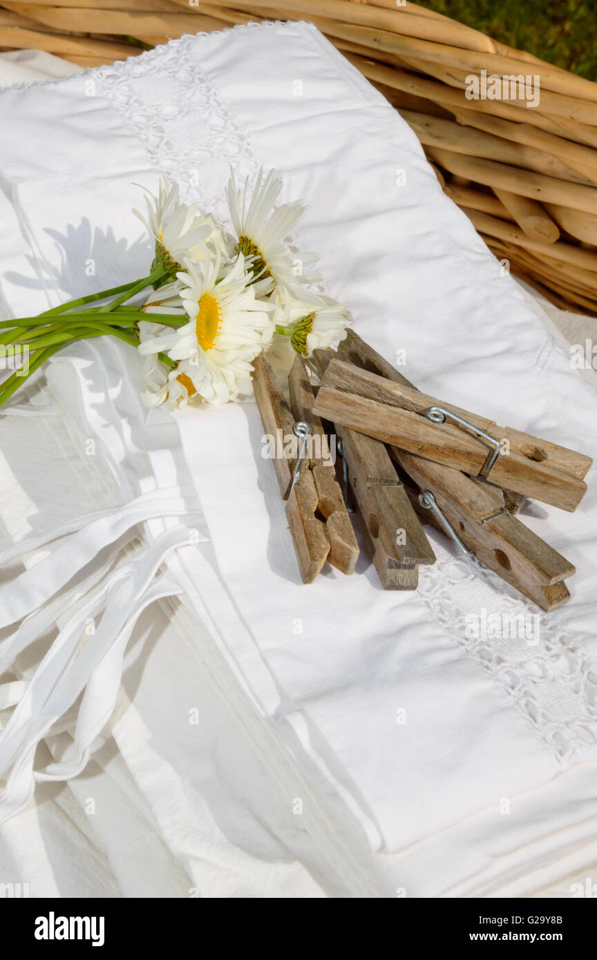 Basket full of clean freshly washed grandmother's linens. Stock Photo