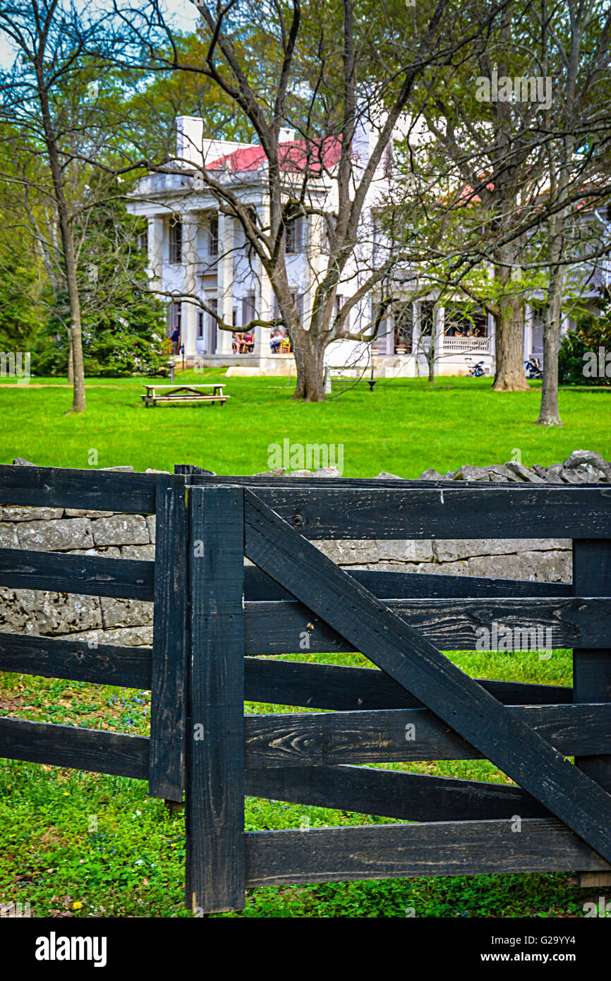 Tourists enjoy the Belle Meade Plantation Mansion surrounded by rock walls and wooden fences in Nashville TN Stock Photo