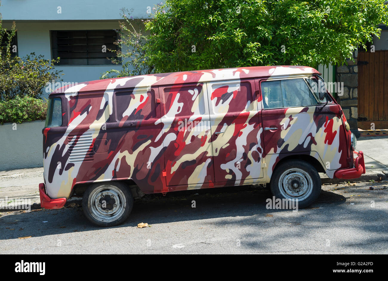 RIO DE JANEIRO - MARCH 29, 2016: A Volkswagen Kombi van, which ended production in 2013, customized in decorative camo pattern. Stock Photo
