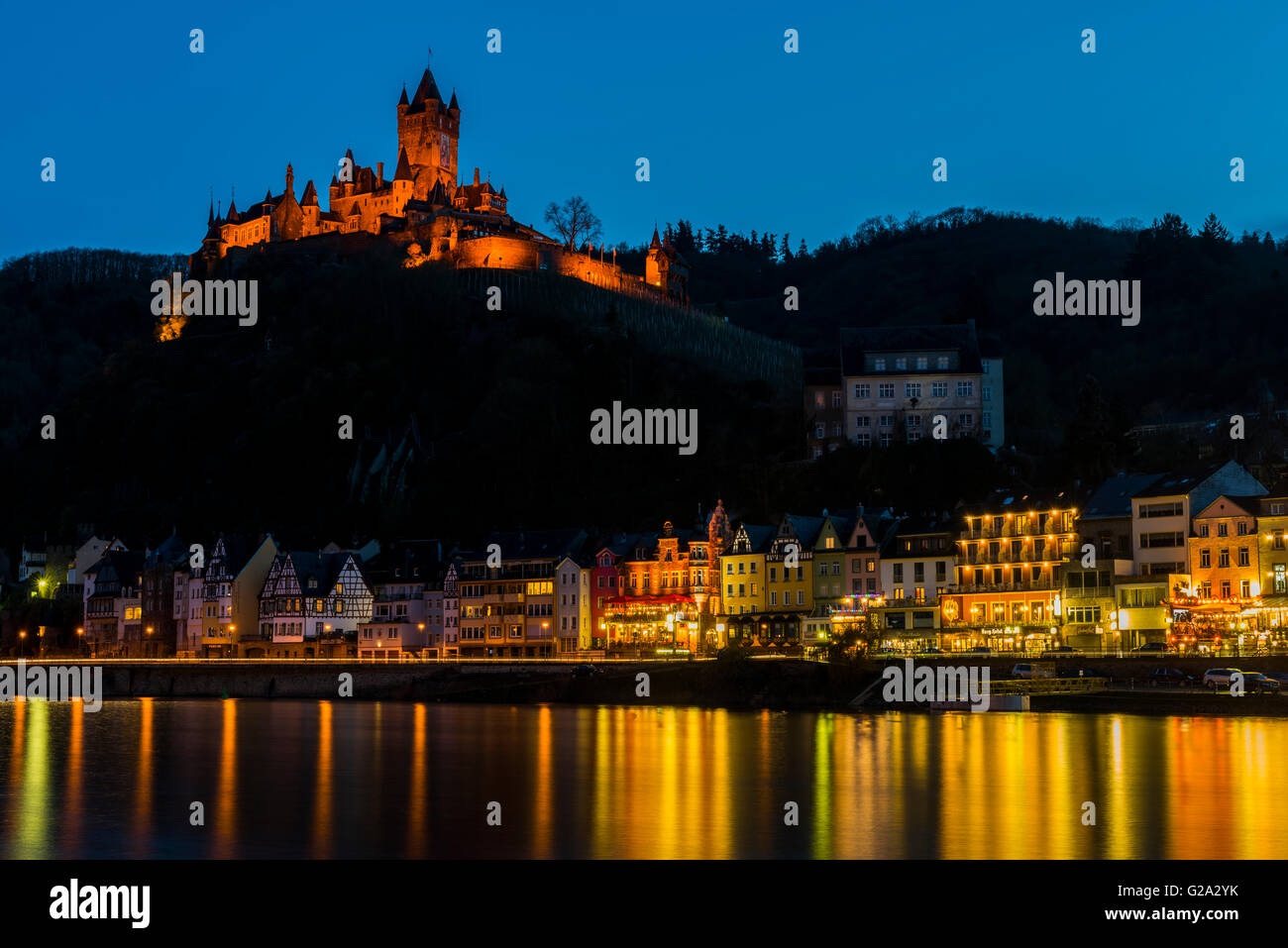 Cochem at the Moselle in Germany at night with lights and a great castle Reichsburg. Stock Photo