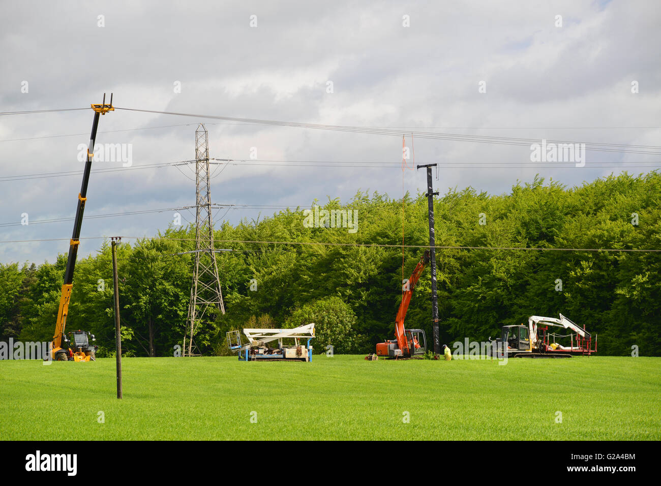 engineers constructing new power line pylons and cable leeds yorkshire united kingdom Stock Photo