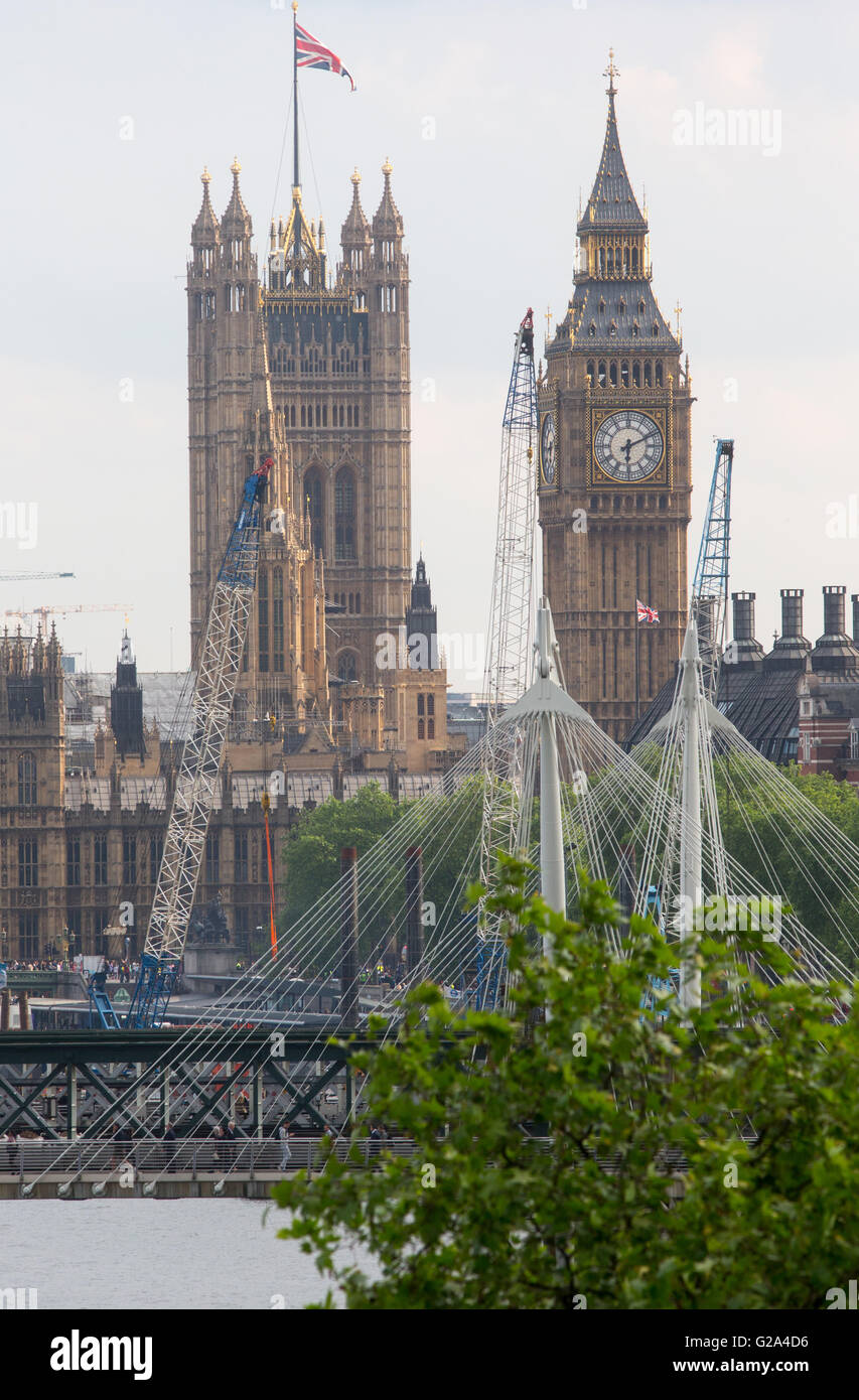View of the Houses of Parliament with Hungerford Bridge and Big Ben Stock Photo