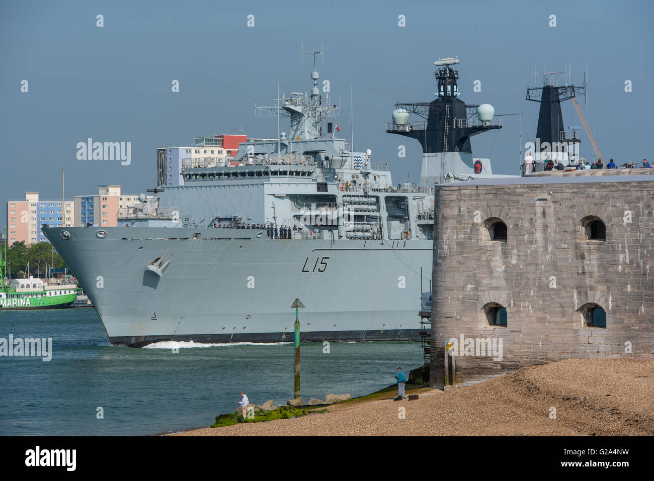 The British Royal Navy Assault Ship, HMS Bulwark (L15), passes the Round Tower at Portsmouth, UK on the 27th May 2016. Stock Photo