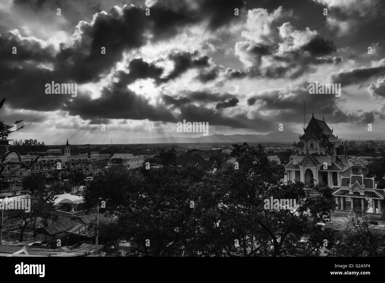 Light of rays shining through dark clouds. Thailand. low key style photography, Black and white Stock Photo