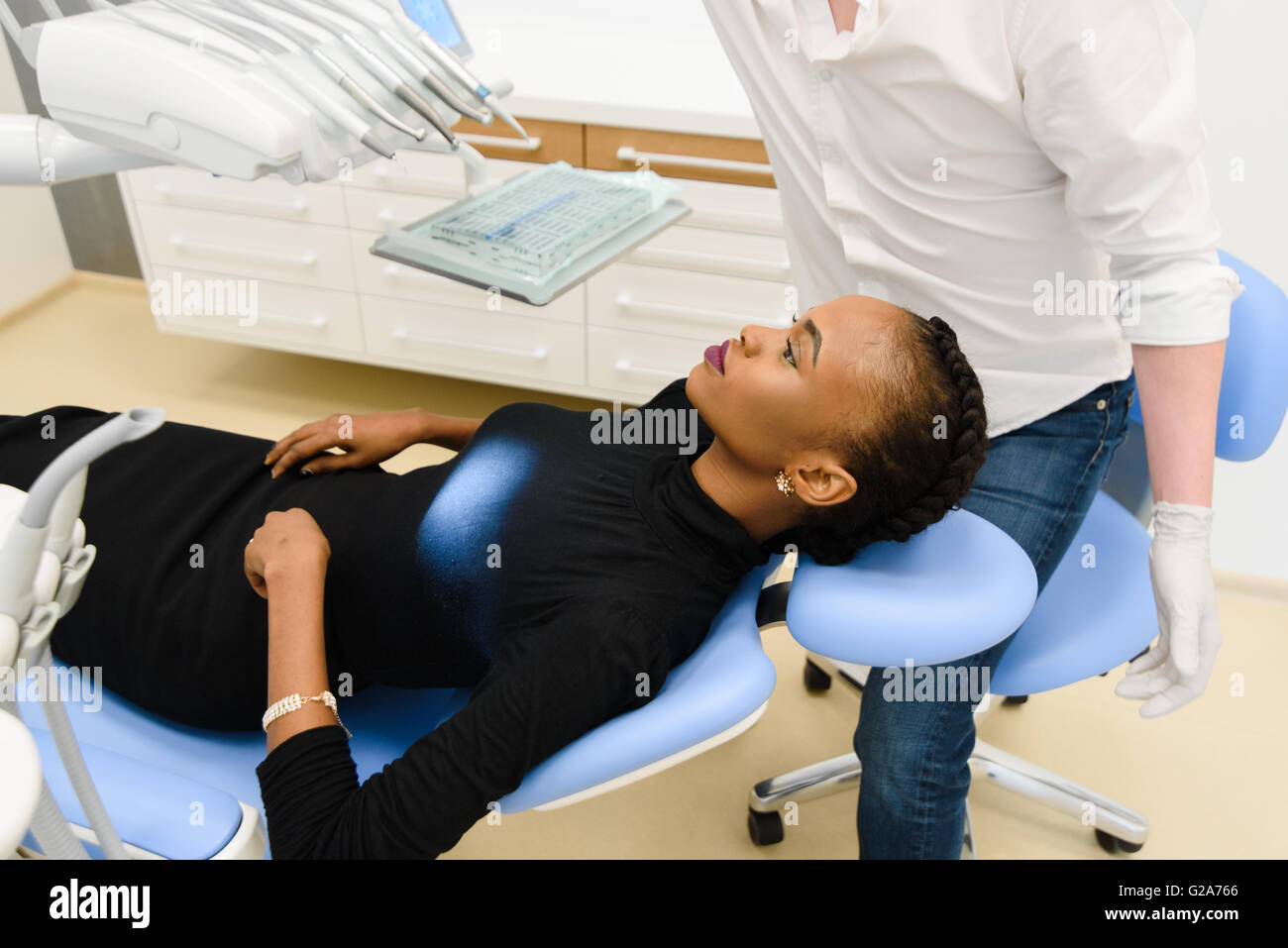 Portrait of beautiful african or black american woman waiting for dental exam Stock Photo
