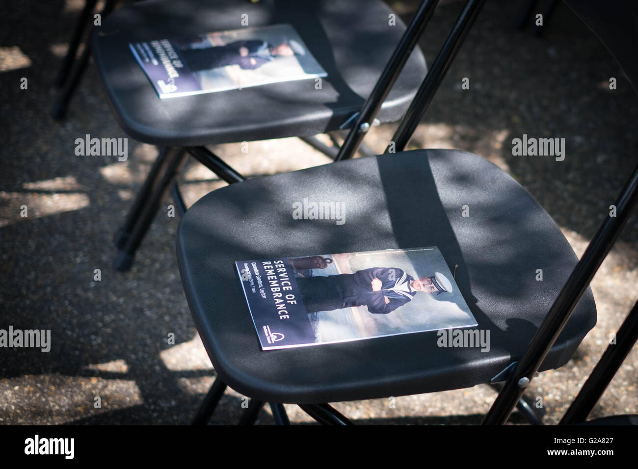 Service of Remembrance booklets placed on chairs during a commemoration event for sixteen year old Jack Cornwell at Coronation Gardens, in Waltham Forest, east London, where a memorial paving stone was unveiled at the war memorial, Jack was posthumously awarded the Victoria Cross following his death 100 years ago, during the Battle of Jutland. Stock Photo