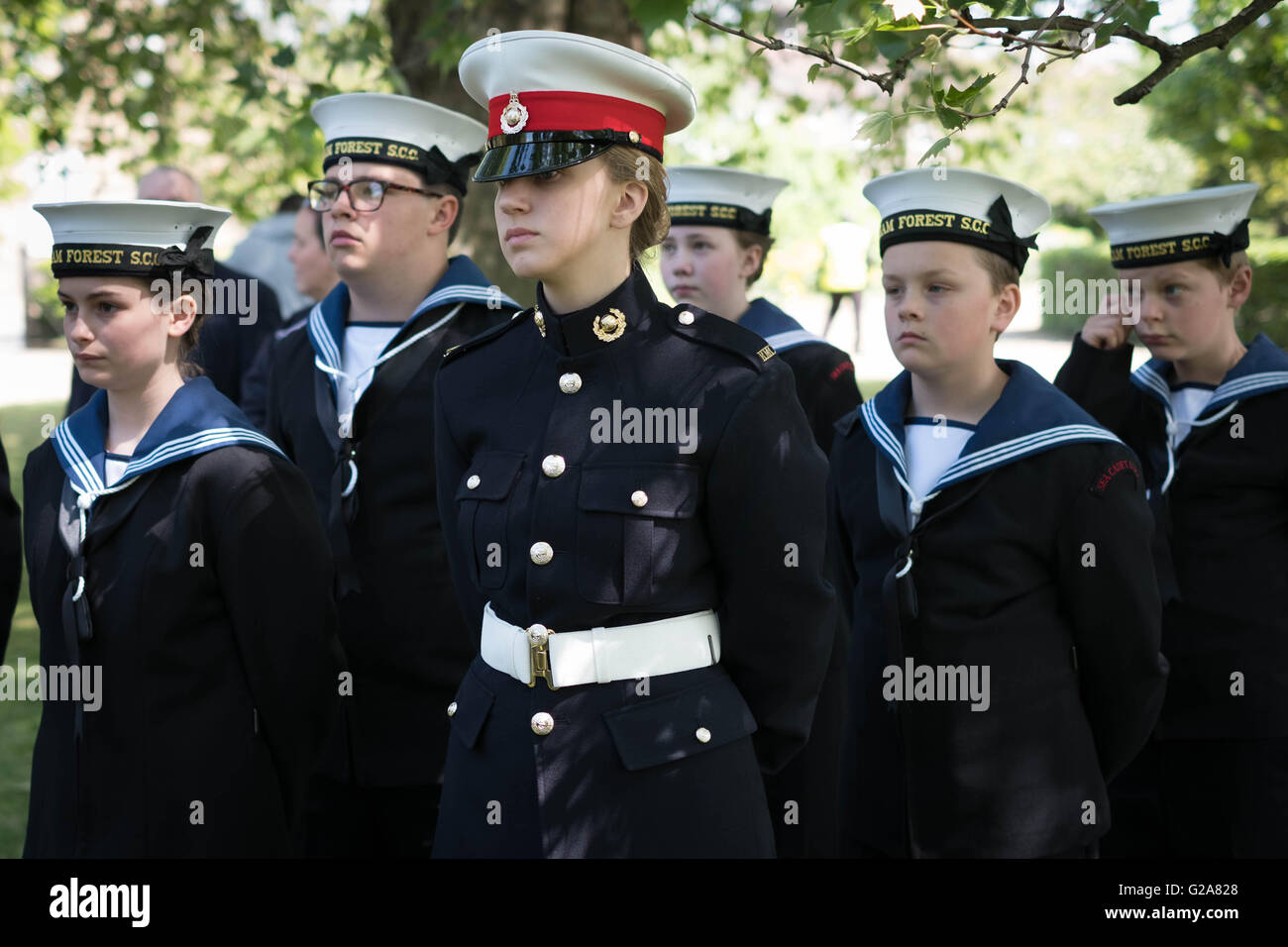 Members of the Royal Navy and Royal Marines cadets stand during a commemoration event for sixteen year old Jack Cornwell at Coronation Gardens, in Waltham Forest, east London, where a memorial paving stone was unveiled at the war memorial, Jack was posthumously awarded the Victoria Cross following his death 100 years ago, during the Battle of Jutland. Stock Photo