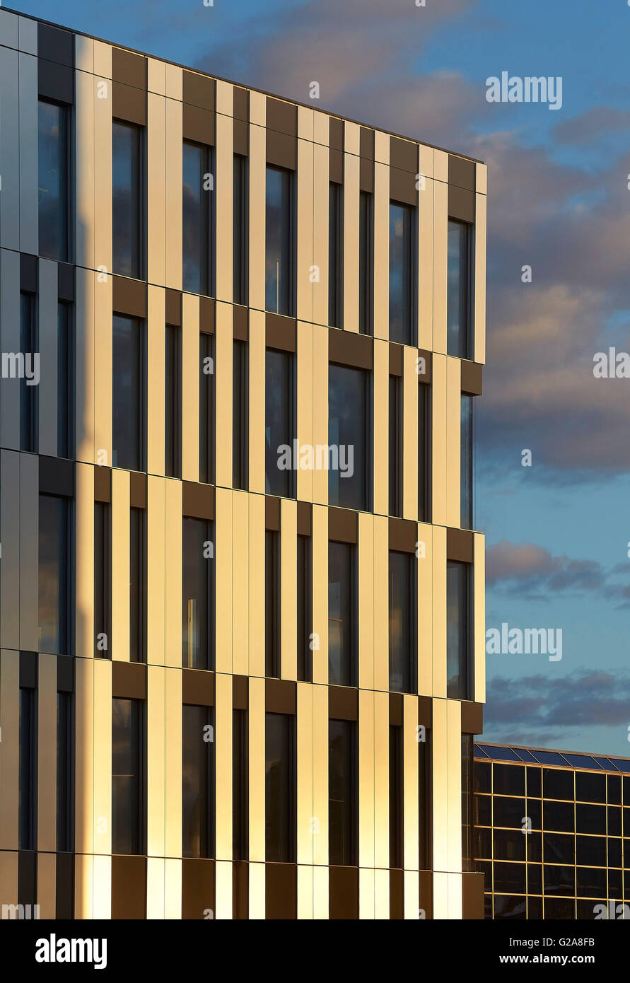Graphic facade paneling against dusk sky. Fornebuporten, Oslo, Norway. Architect: DARK, 2015. Stock Photo