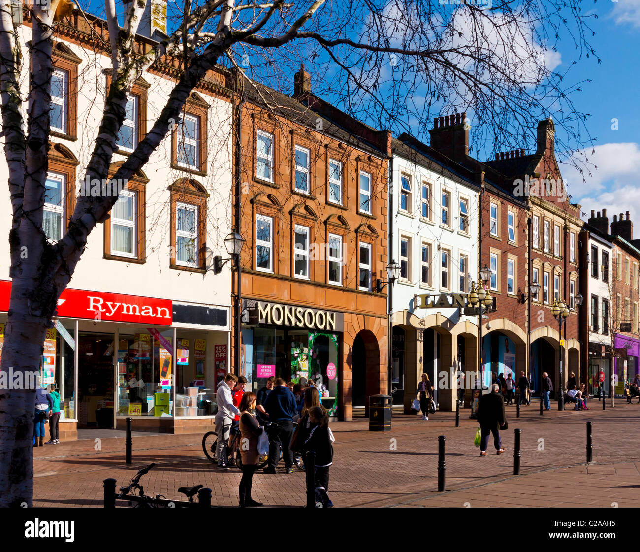 Shoppers in Carlisle city centre in north Cumbria north west England UK Stock Photo