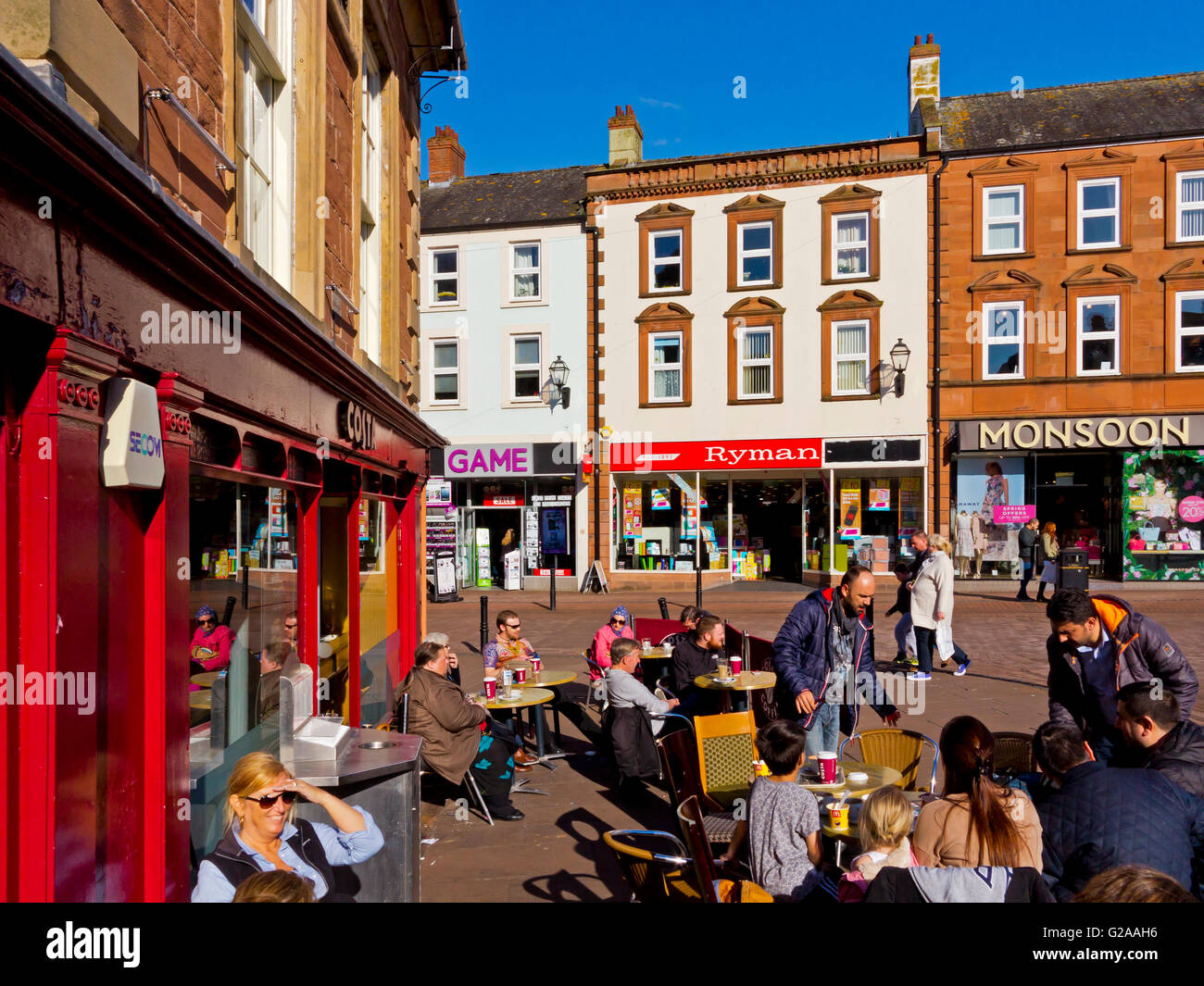 Shoppers sitting outside Costa Coffee shop in Carlisle city centre in north Cumbria north west England UK Stock Photo