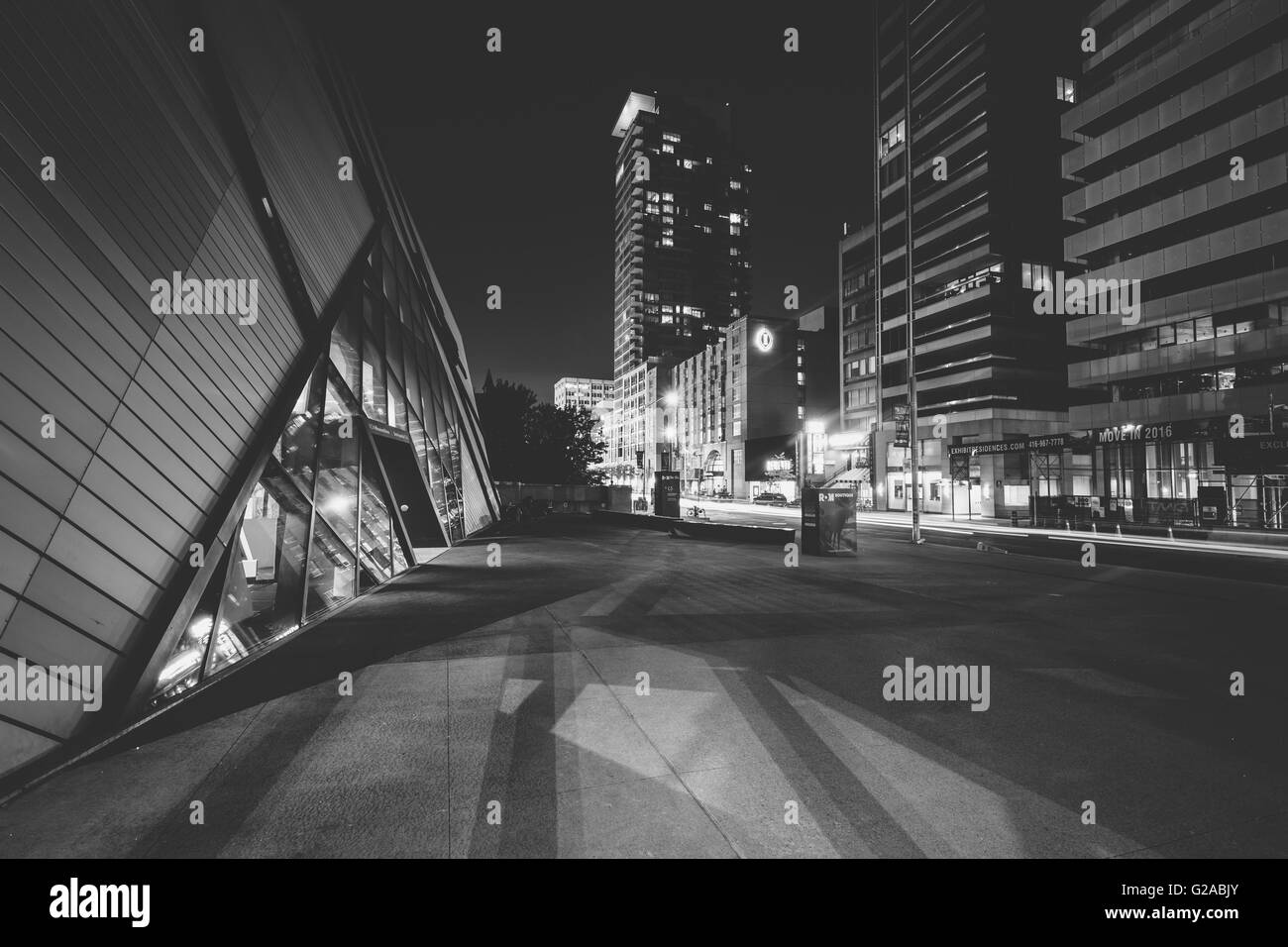 The exterior of the Royal Ontario Museum and Bloor Street West at night, in the Discovery District, Toronto, Ontario. Stock Photo