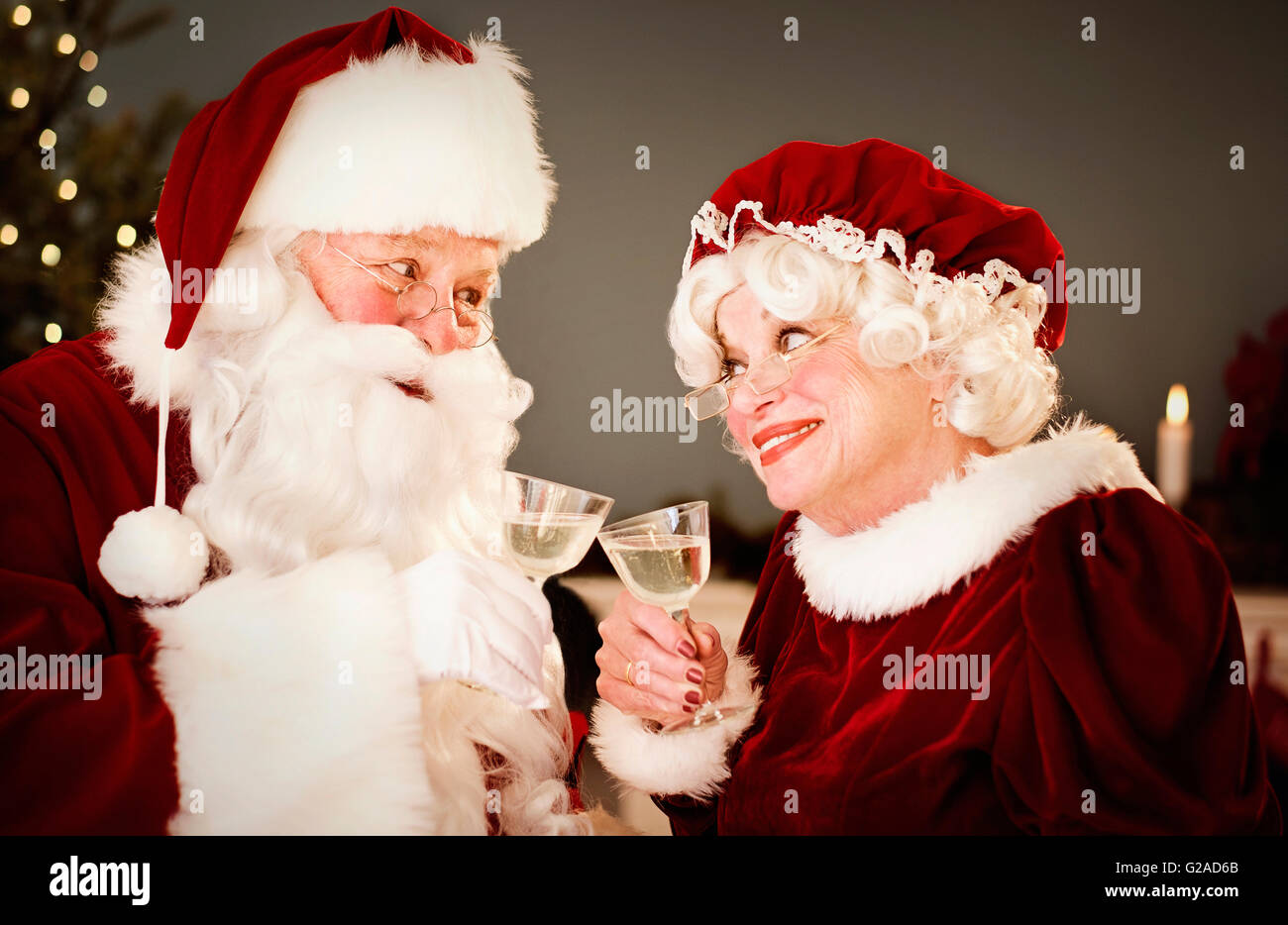 Santa and Mrs. Claus drinking champagne Stock Photo - Alamy