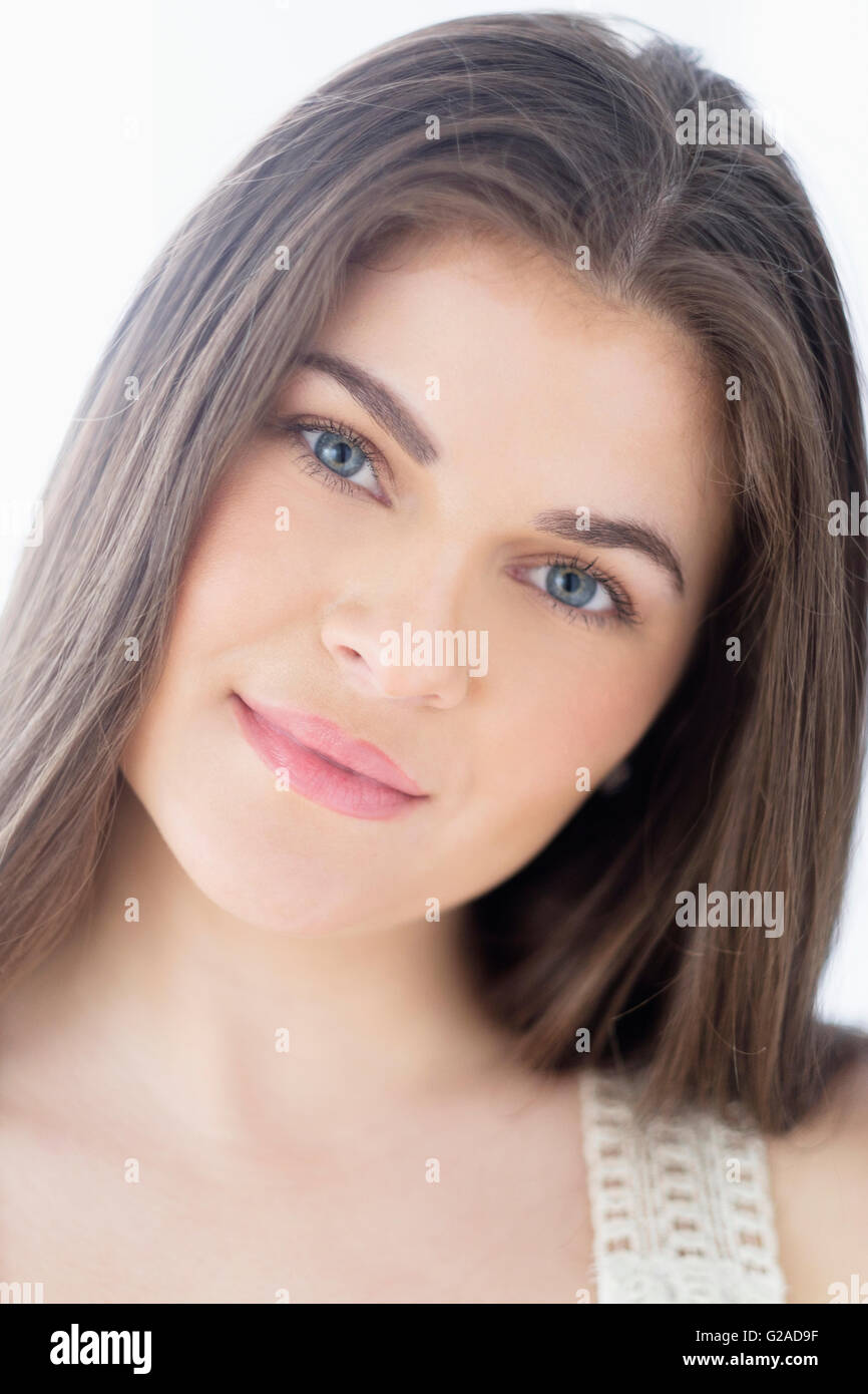 Portrait of young woman with brown hair Stock Photo - Alamy