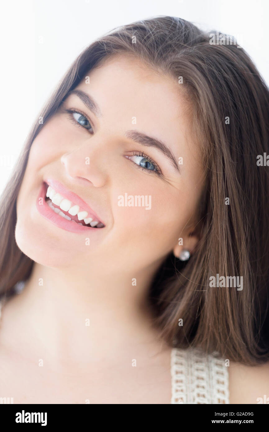 Portrait of young woman with brown hair Stock Photo - Alamy