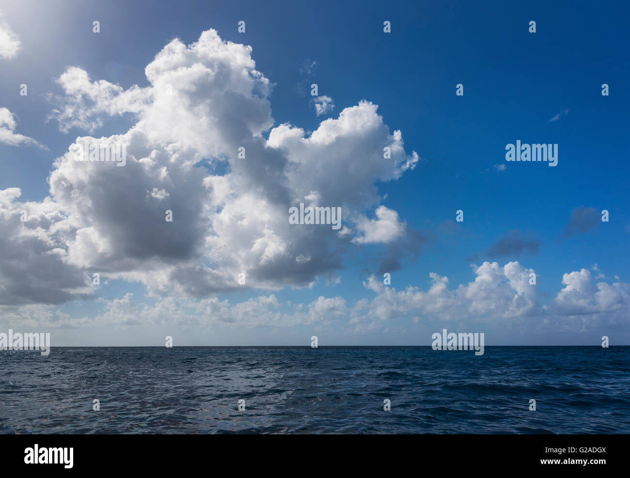 White clouds over tropical sea Stock Photo - Alamy