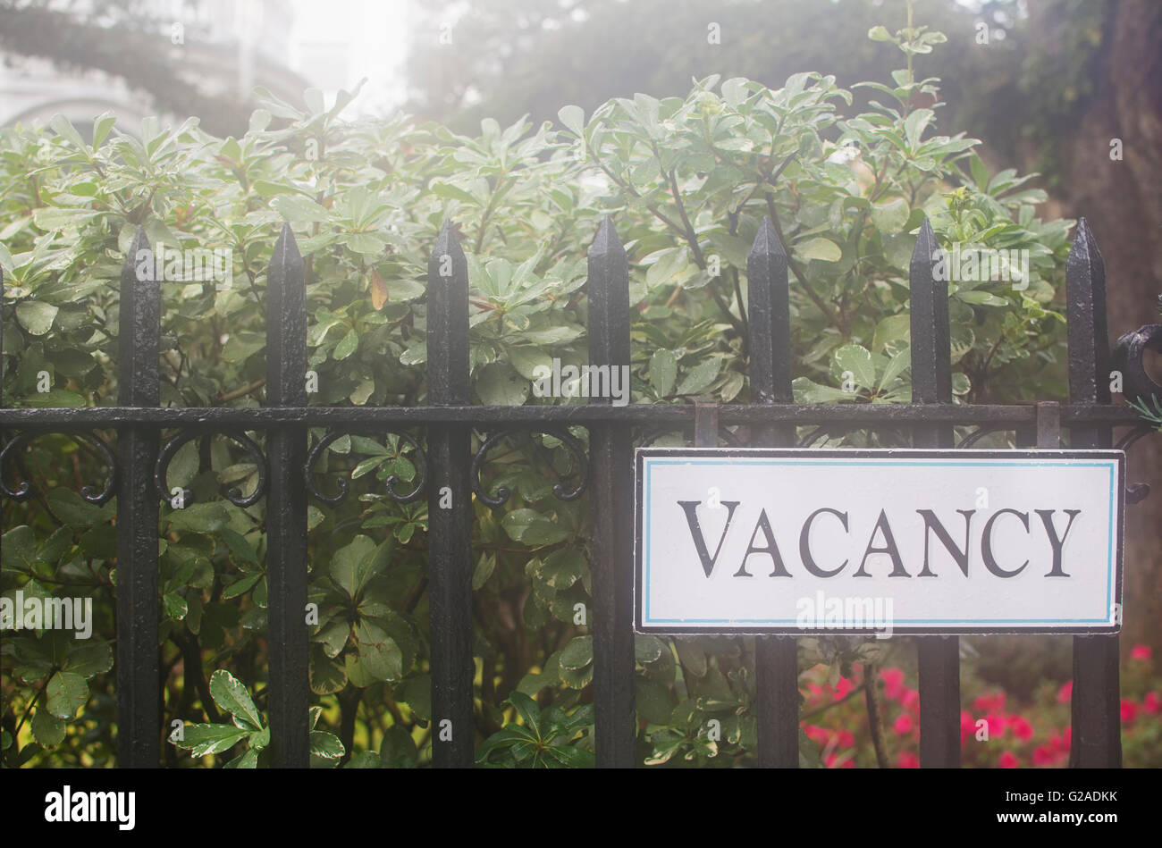 Vacancy sign on hotel's fence Stock Photo