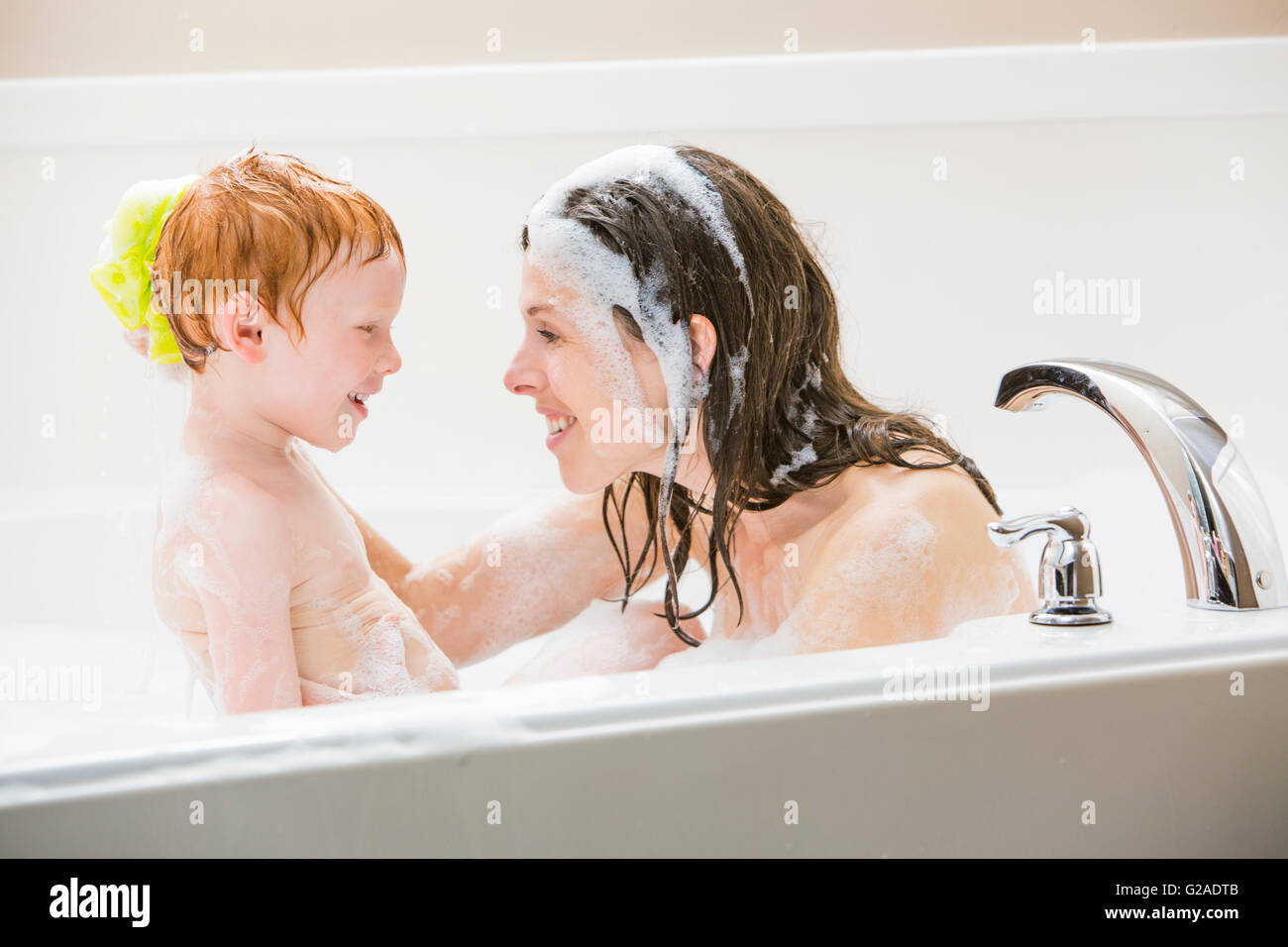 Mother and son (23) having bubble bath Stock Photo Alamy