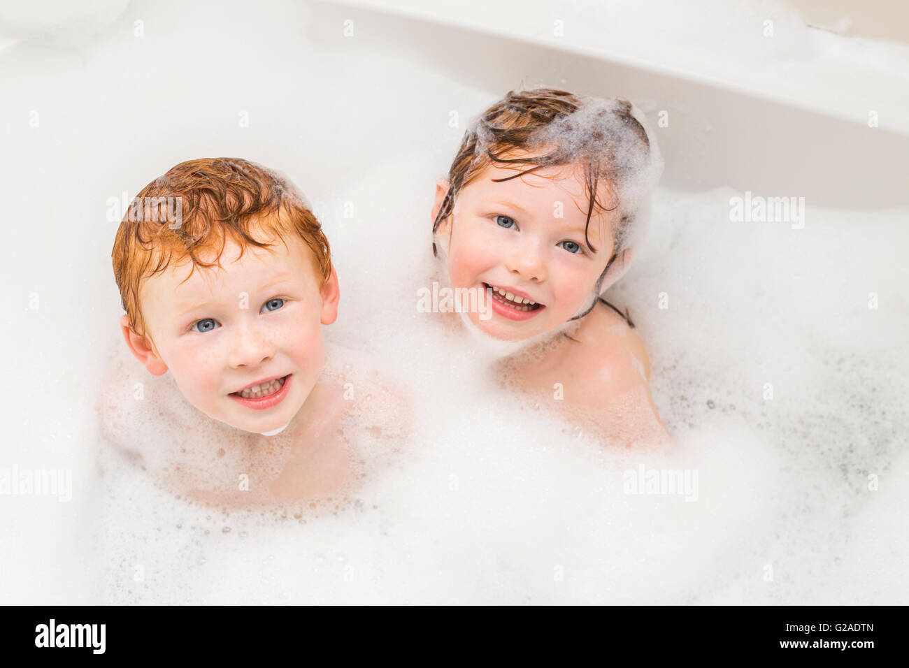 Sister and brother (2-3, 4-5) having bubble bath Stock Photo