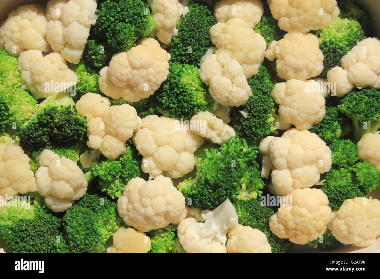 Close up of broccoli and cauliflower florets symbolizing healthy eating and background vegetables Stock Photo