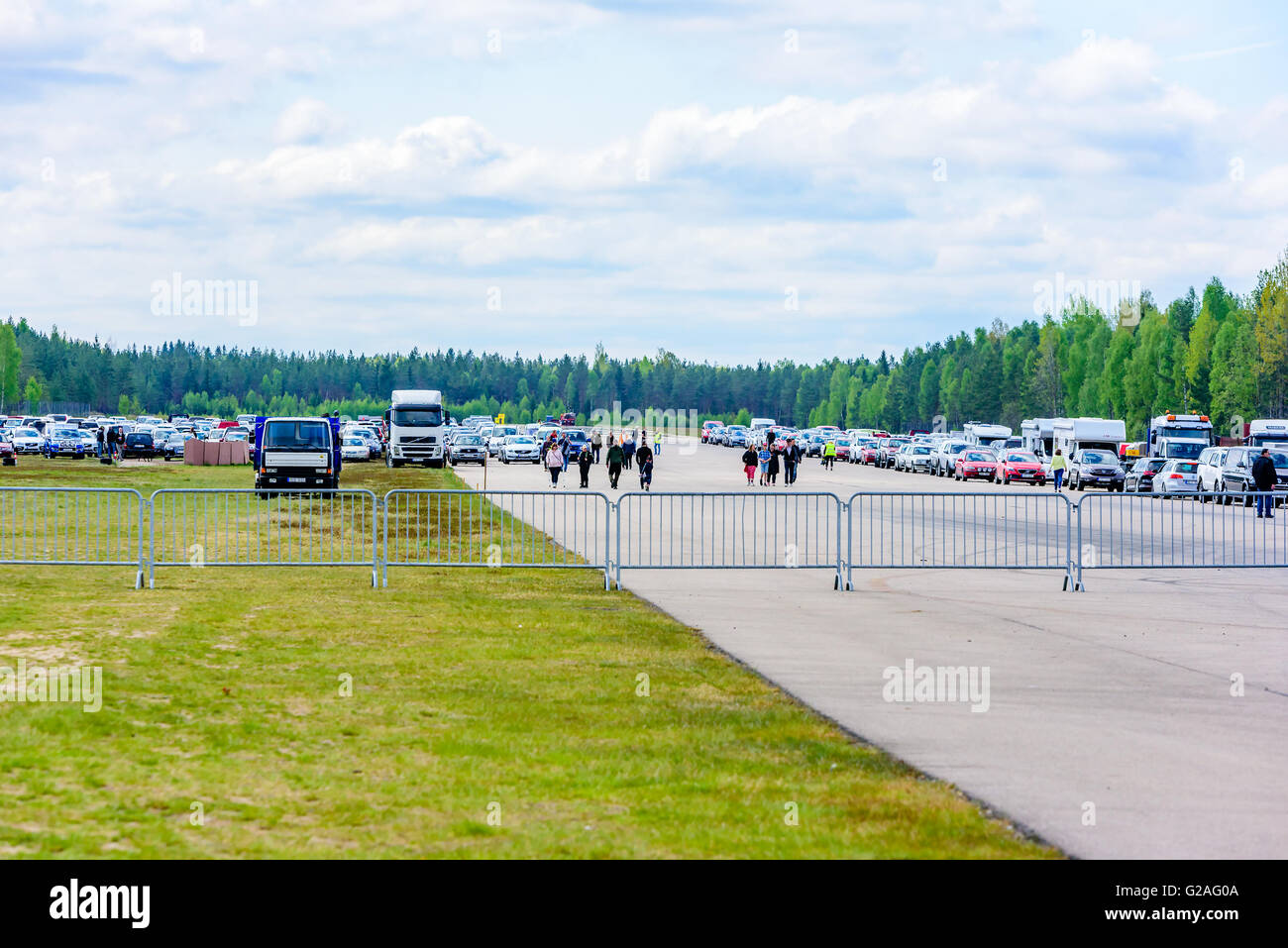 Emmaboda, Sweden - May 14, 2016: Forest and tractor (Skog och traktor) fair. People arriving from the parked cars at the old air Stock Photo