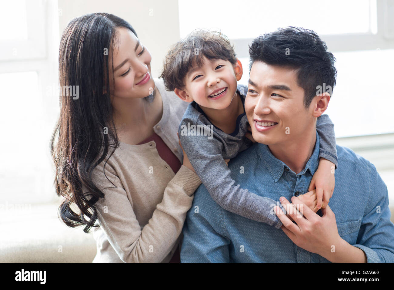 Happy young family Stock Photo - Alamy