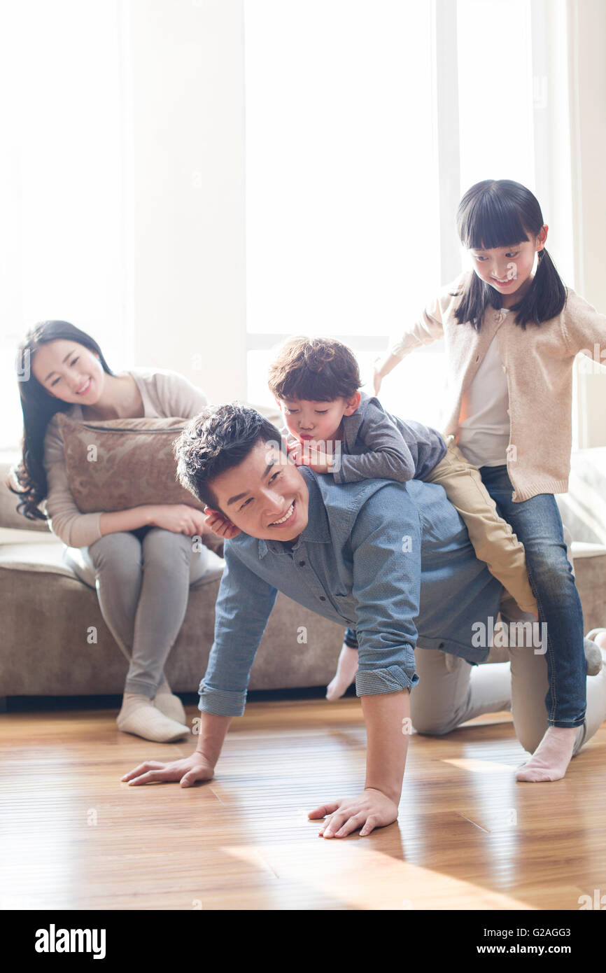 Happy young family Stock Photo - Alamy