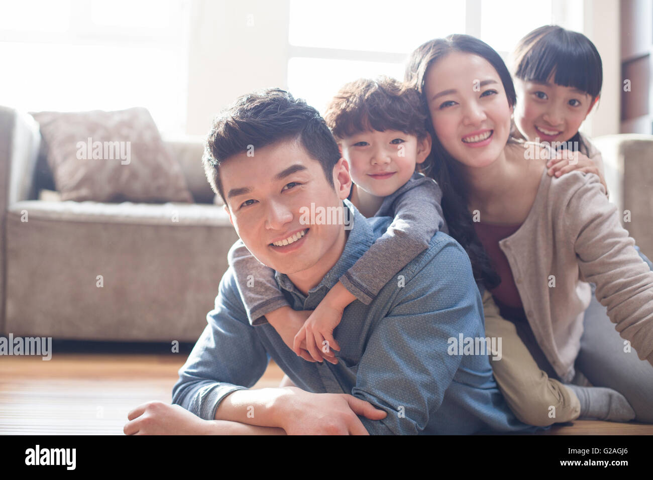 Happy young family Stock Photo - Alamy