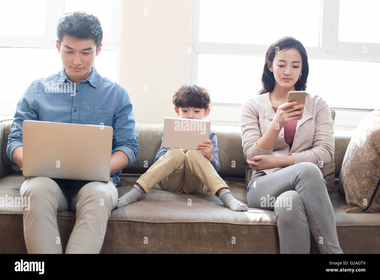 Indian family mobile tablet hi-res stock photography and images - Alamy